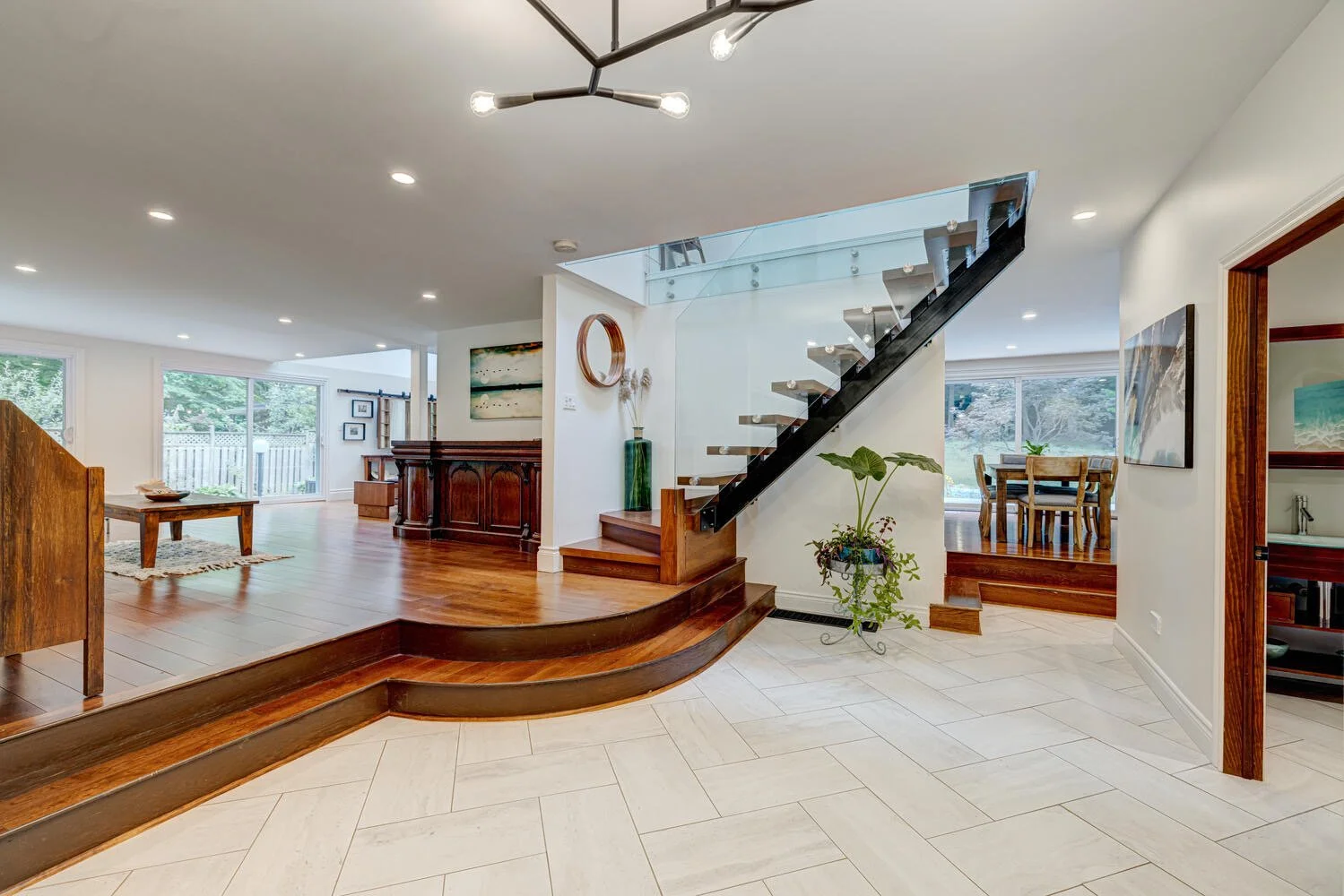 After picture of completed glass staircase, adding modern elegance to the home's interior by Burcon Construction in Komoka, Ontario.