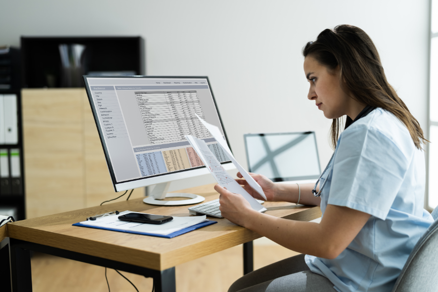 Woman providing remote medical billing and coding services to small medical practices