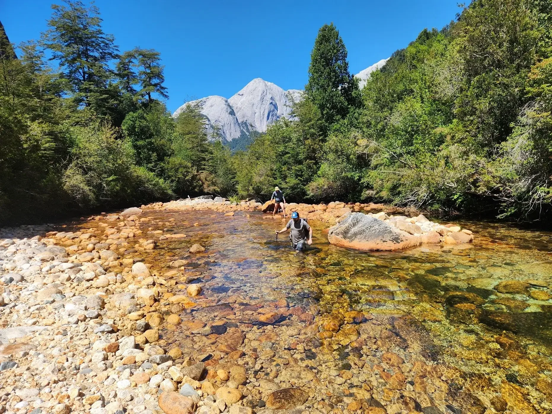 River crossing in a secret valley of Cochamó