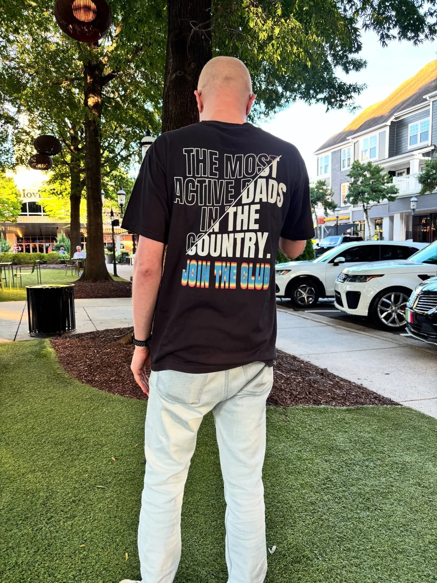 Back of Father wearing a Black Most Active Dads in the Country T Shirt
