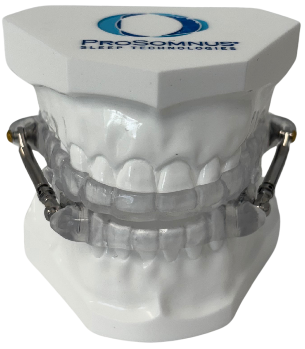 Dental model with braces on upper and lower teeth, placed on a white box labeled ProSomnus Sleep Technologies.