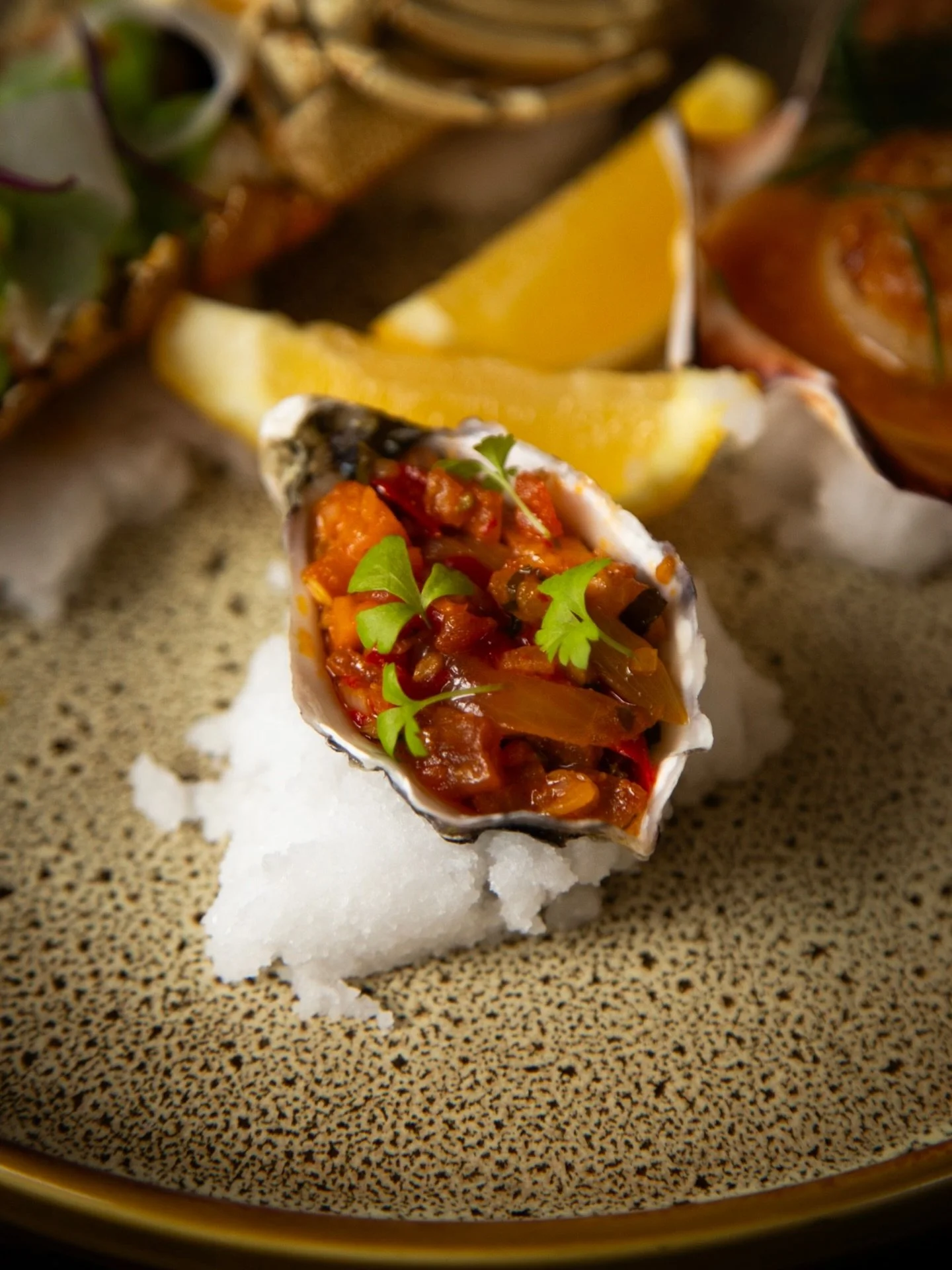 Coffin Bay oysters with spiced tomato and pepper jam, part of our seafood trio that knows how to flirt with an afternoon.
Think seared scallops in tarama salted butter with smoked caviar, fresh dill chives, poached bugs with lemon butter, pea pur&eac