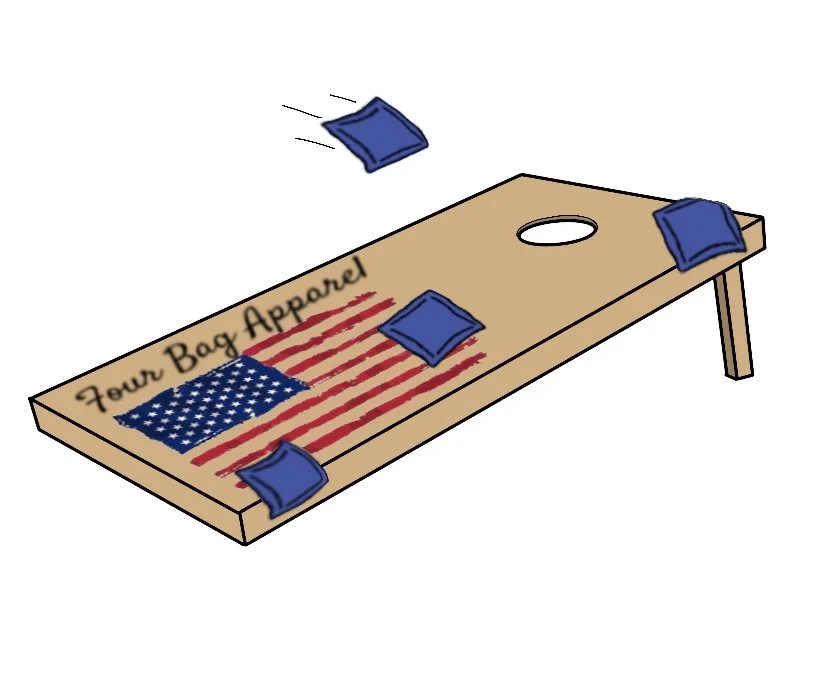 A cornhole game board with blue bean bags, some in motion, featuring a printed American flag and the words "Four Bag Apparel."