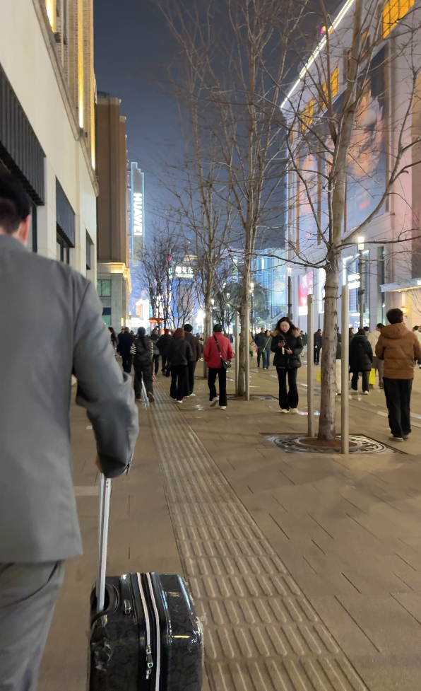 Hotel staff walking us to The Shanghai EDITION hotel entrance on Nanjing Pedestrian Road