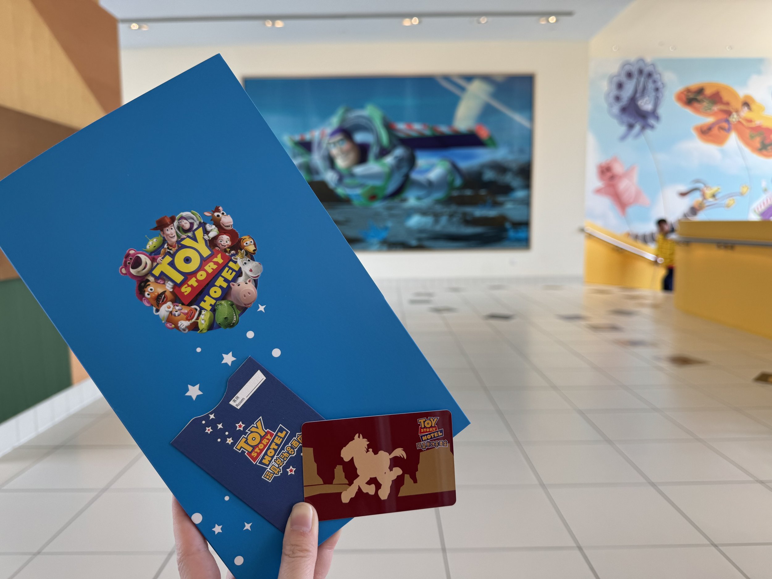 Folder with hotel information and room card received at early check-in at Toy Story Hotel in Shanghai Disney Resort