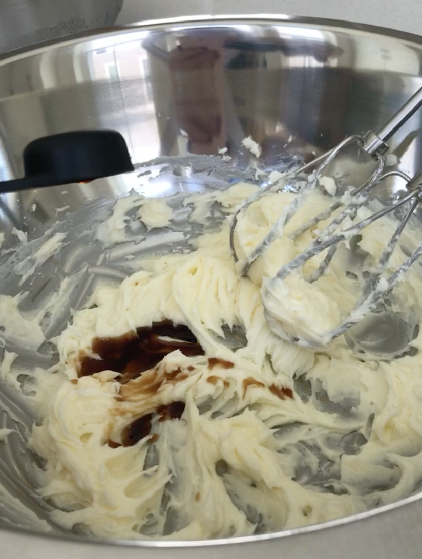  Beaten butter with vanilla in a metal mixing bowl 
