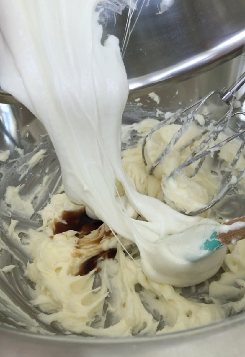  Butter, vanilla, and marshmallow fluff in a metal mixing bowl 