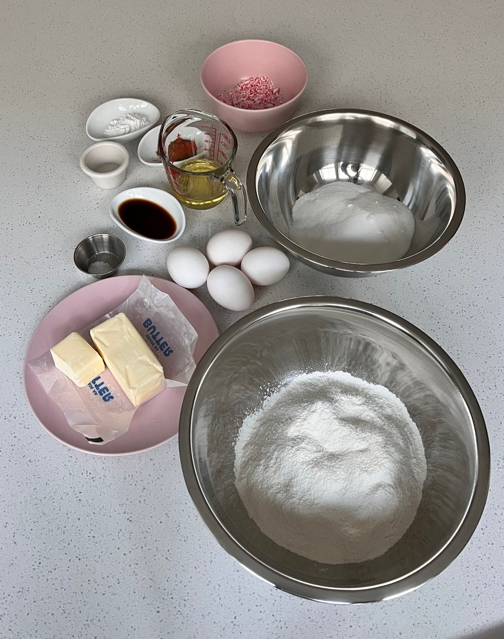  Ingredients for peppermint churro cake: flour, sugar, butter, eggs, vanilla, oil, crushed peppermint, cinnamon, baking powder, salt 