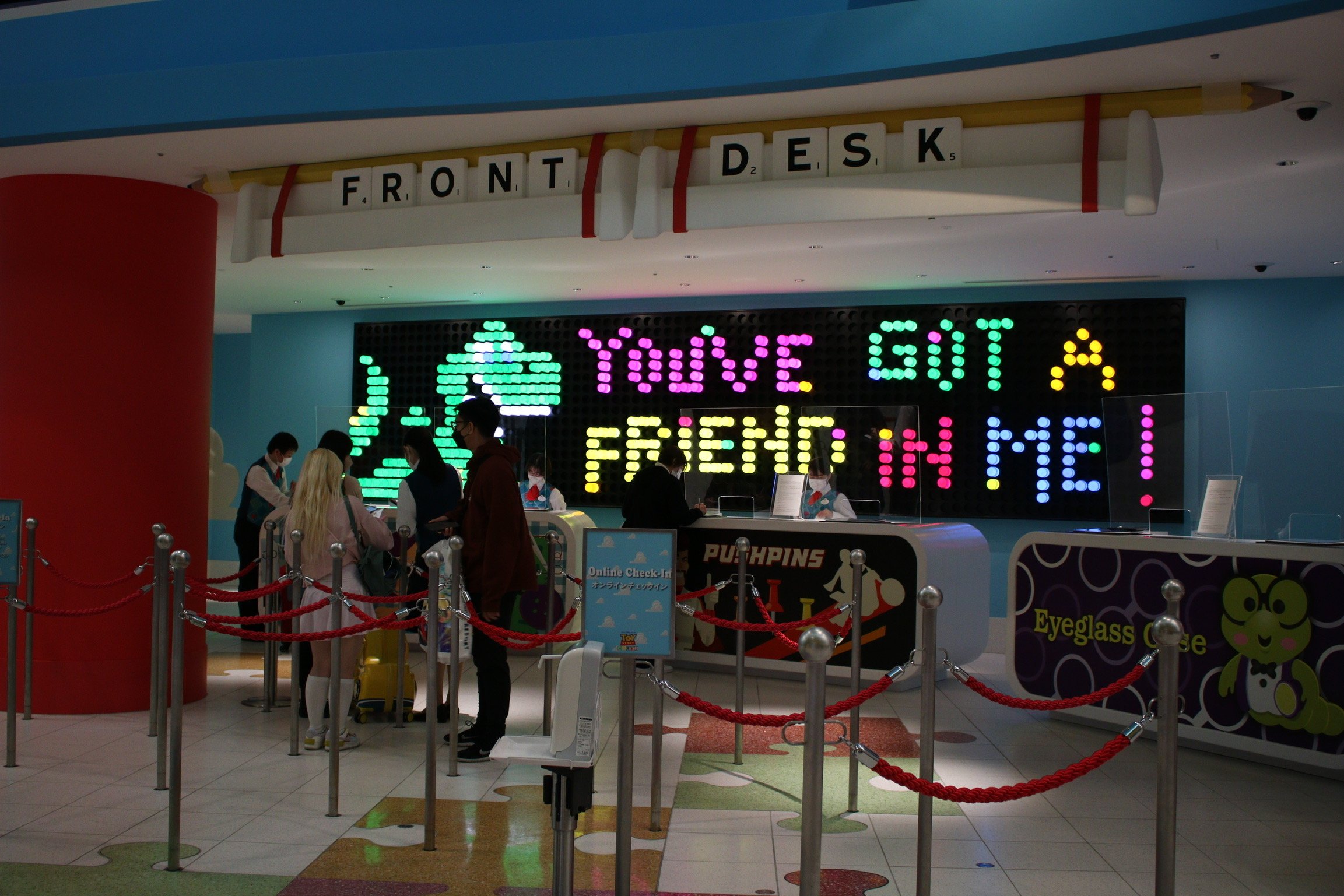  Light up peg board at the hotel check in guest in the shape of a dinosaur and the words You’ve Got a Friend in Me 