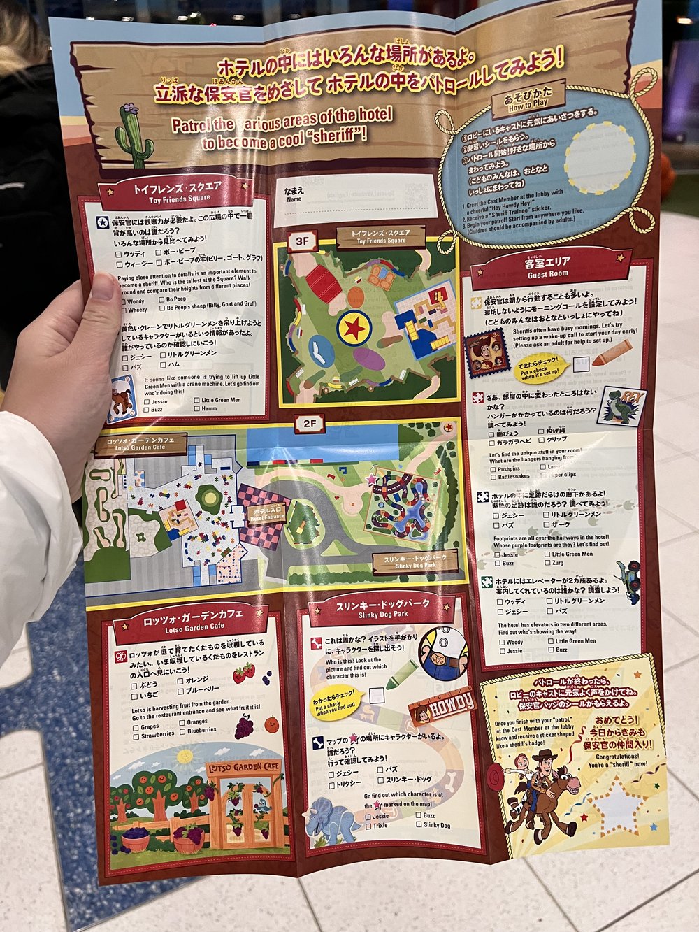  Opened Toy Story hotel guide with scavenger hunt tasks in different sections 