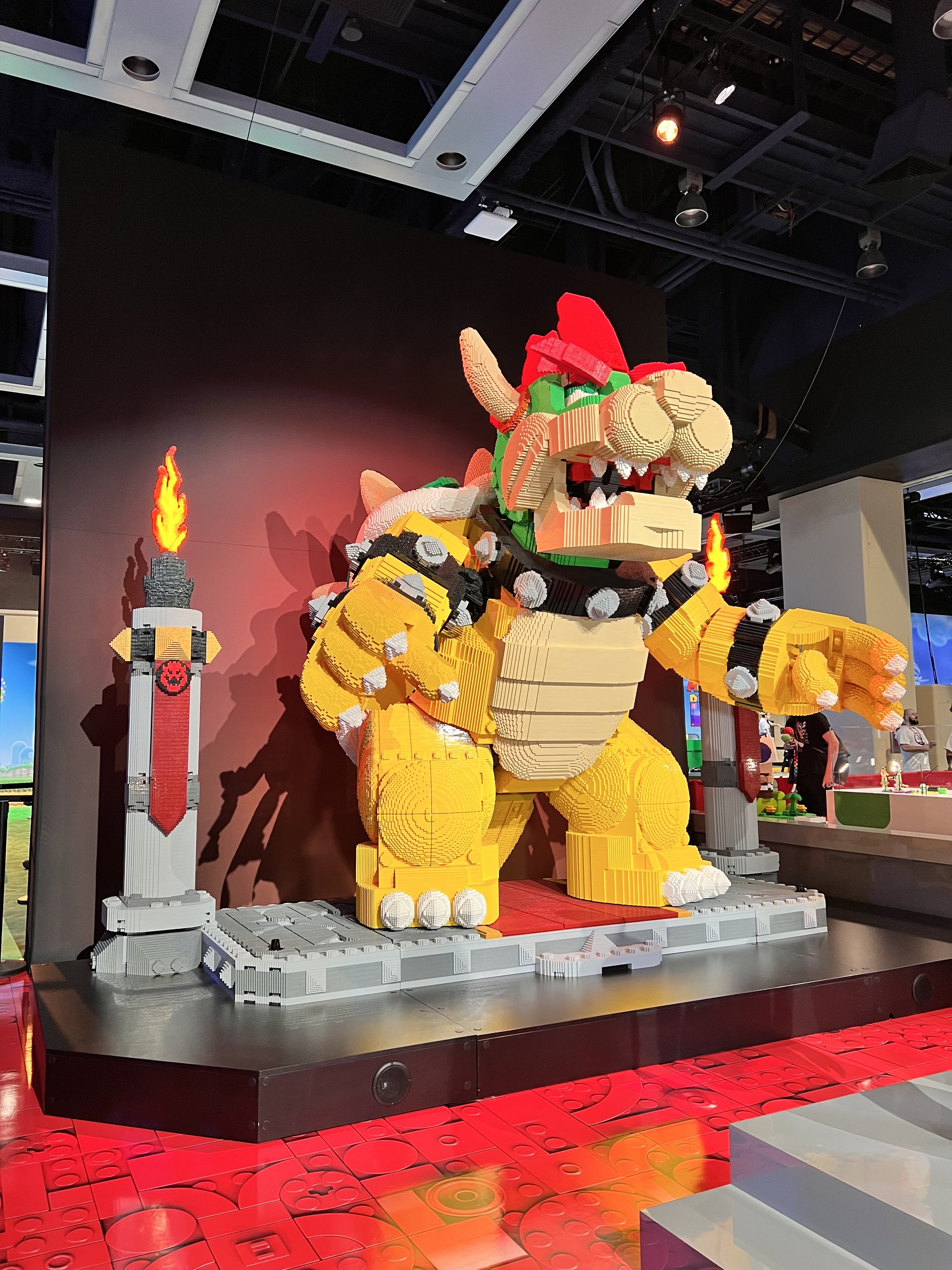  Giant lego Bowser standing on a stage 