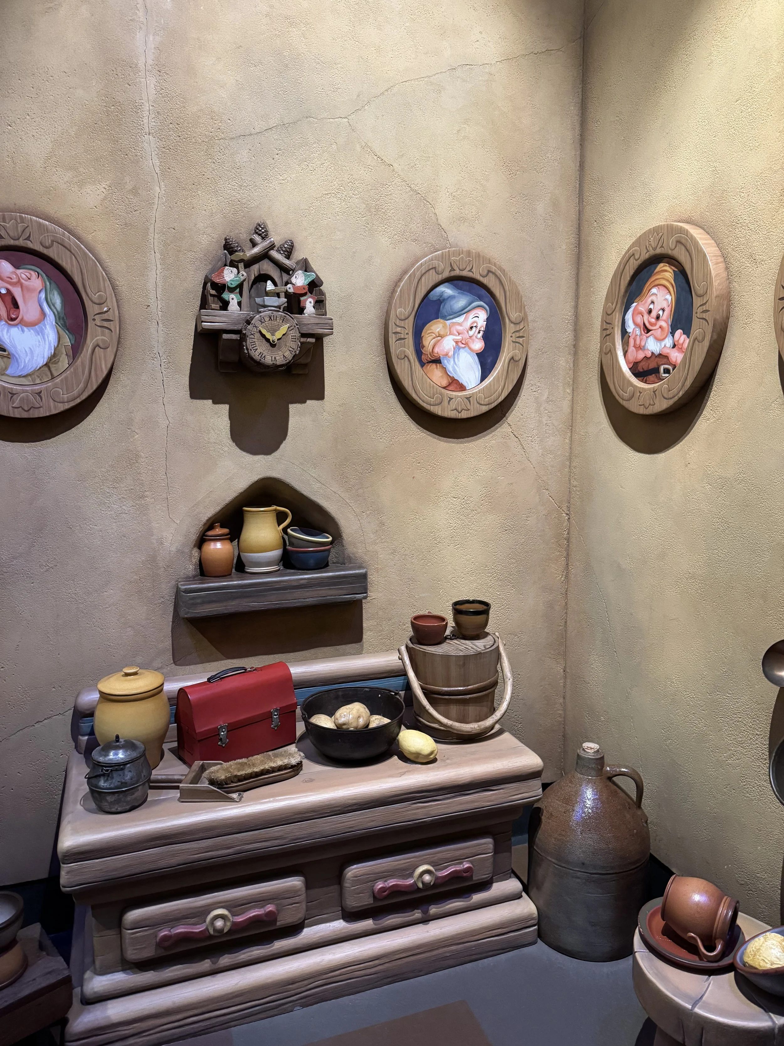 Nook inside the dwarves house with portraits of the dwarves from Snow White  
