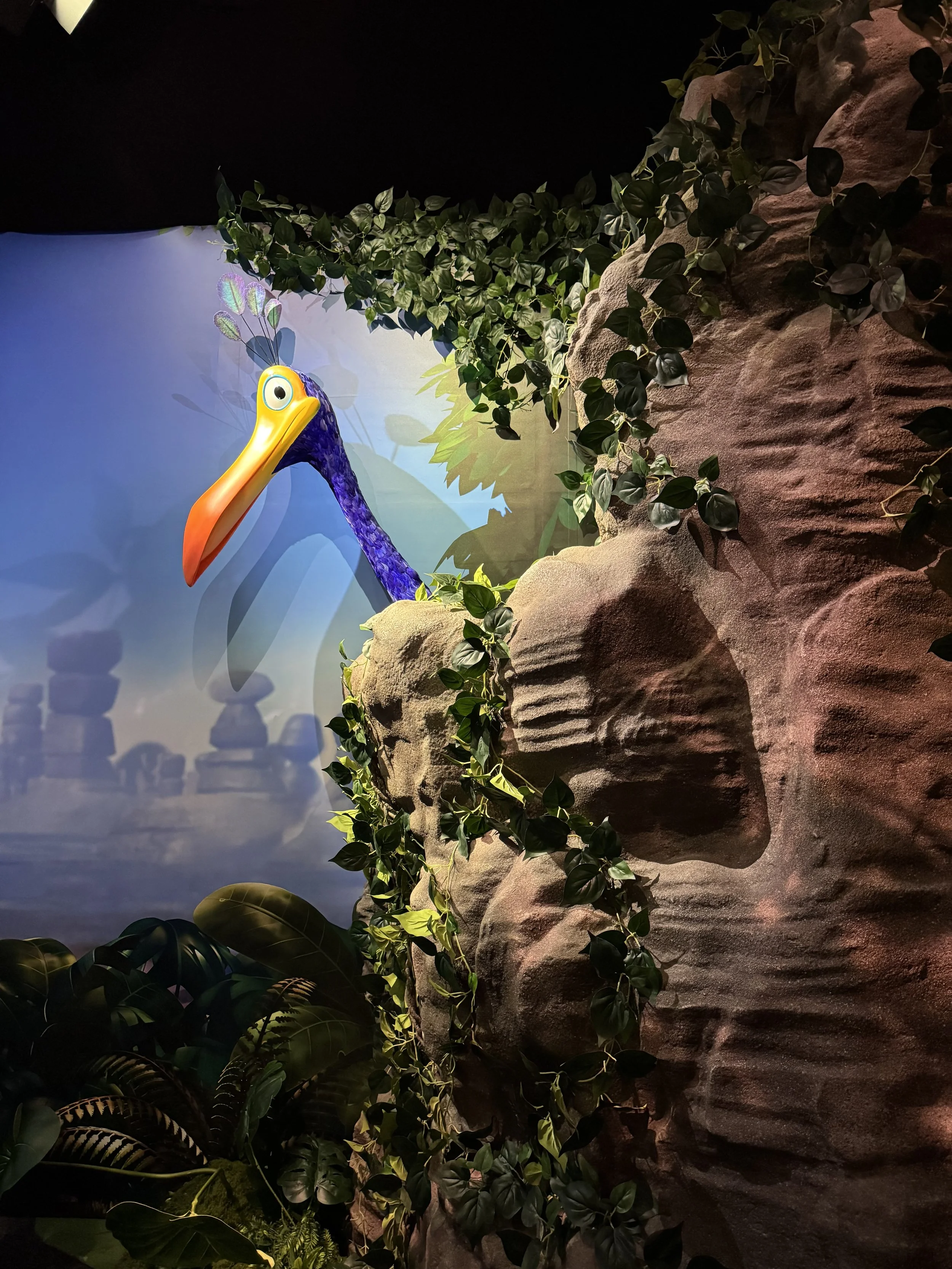  Kevin bird from Up peeking out from behind rocks 