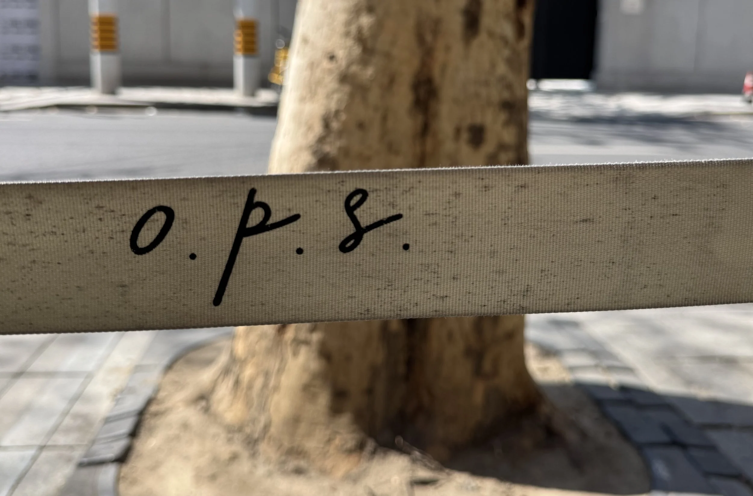 stanchion rope outside with o.p.s. cafe sign