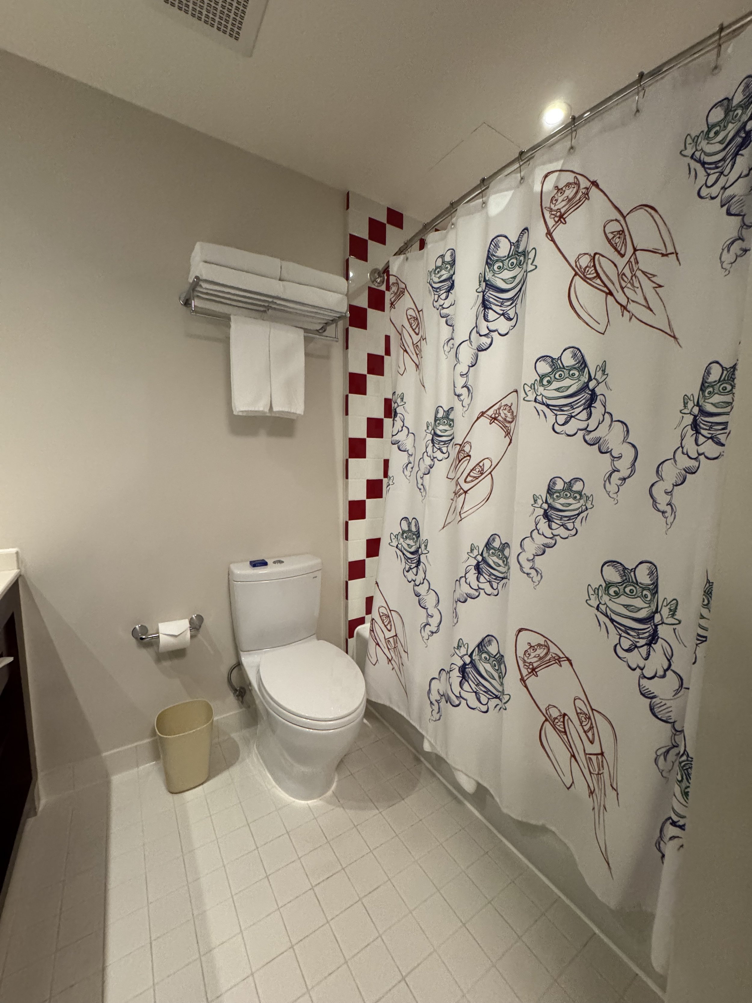 Bathroom with Pizza Planet shower curtain