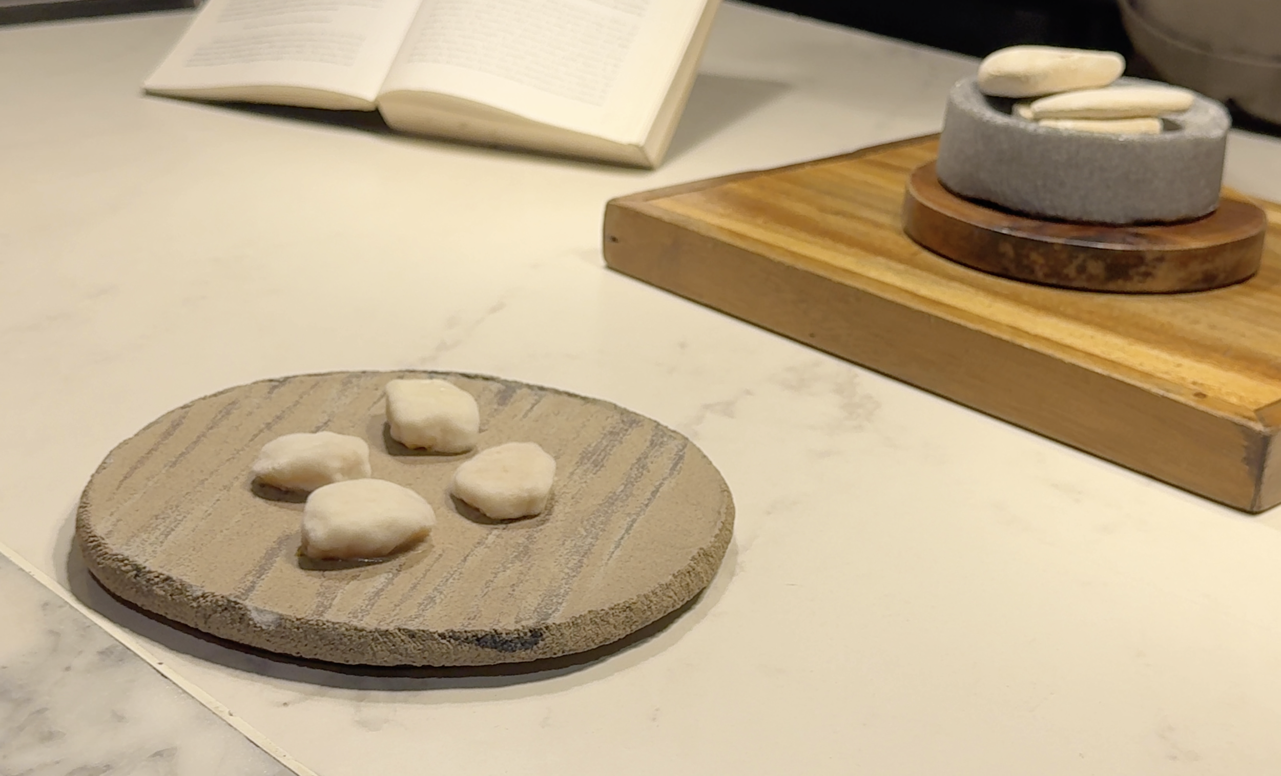 Fermented mango on a wooden plate