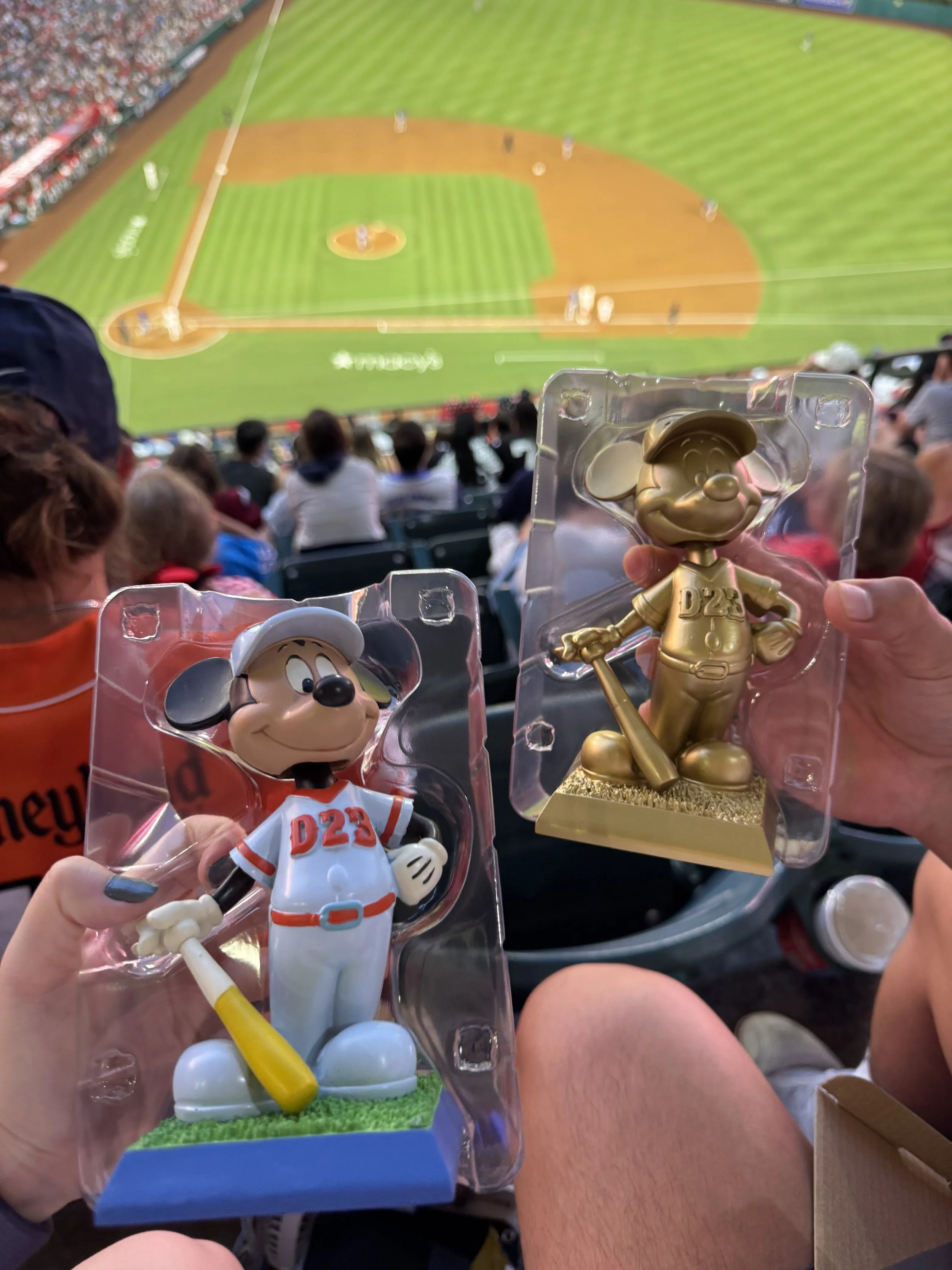 Regular and gold edition Mickey bobbleheads given at the D23 Day at Angels Stadium day
