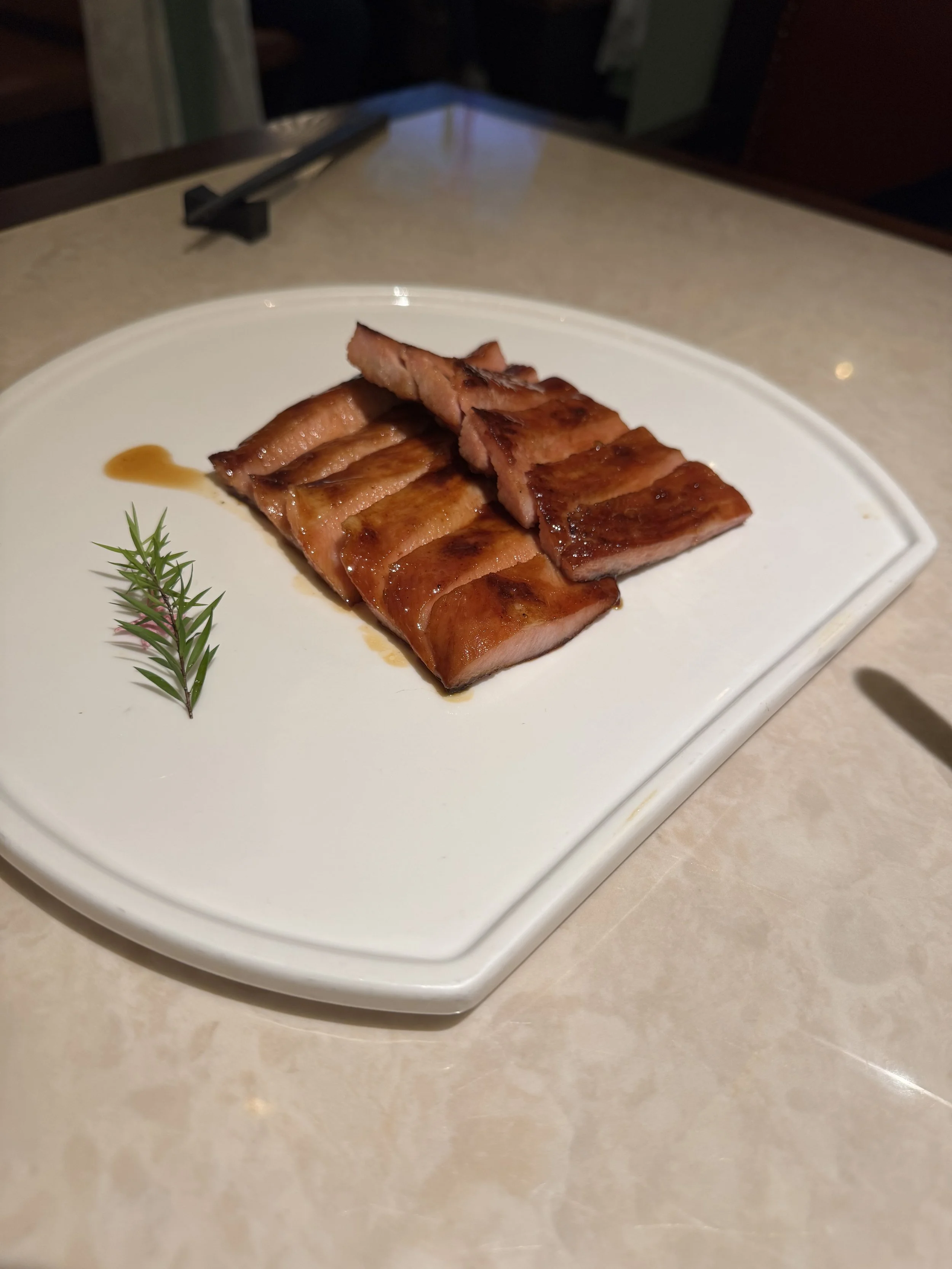 Plate of sliced pork neck