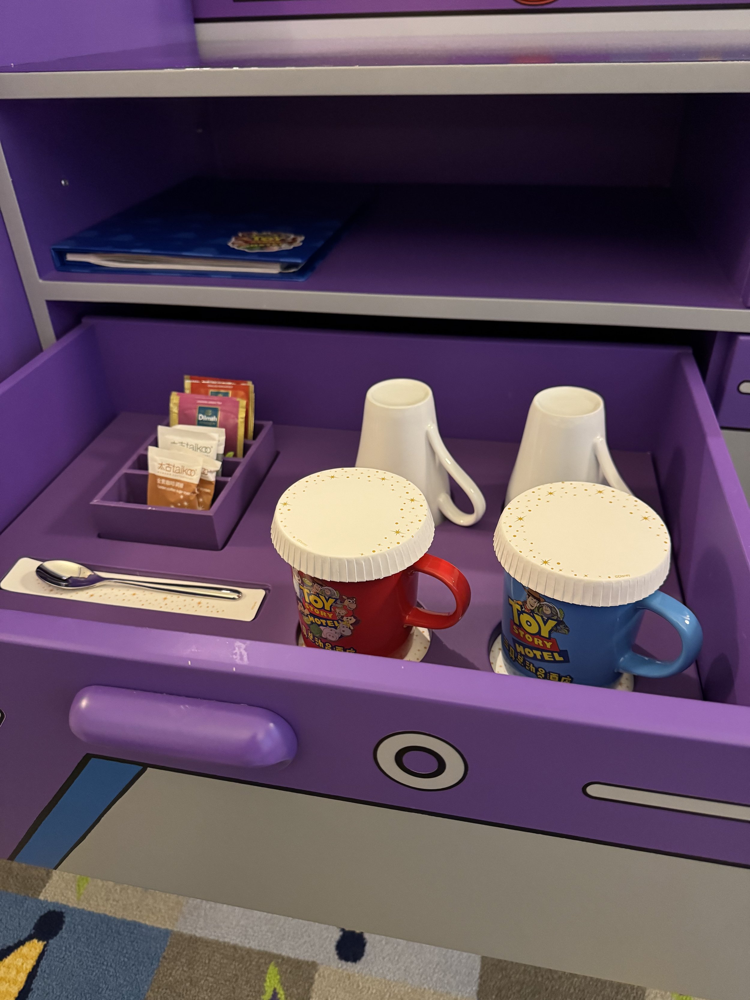 Toy Story themed mugs in the Toy Story Hotel room