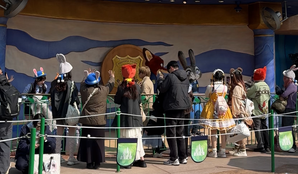 Nick and Judy mascots in Zootopia with a meet and greet line