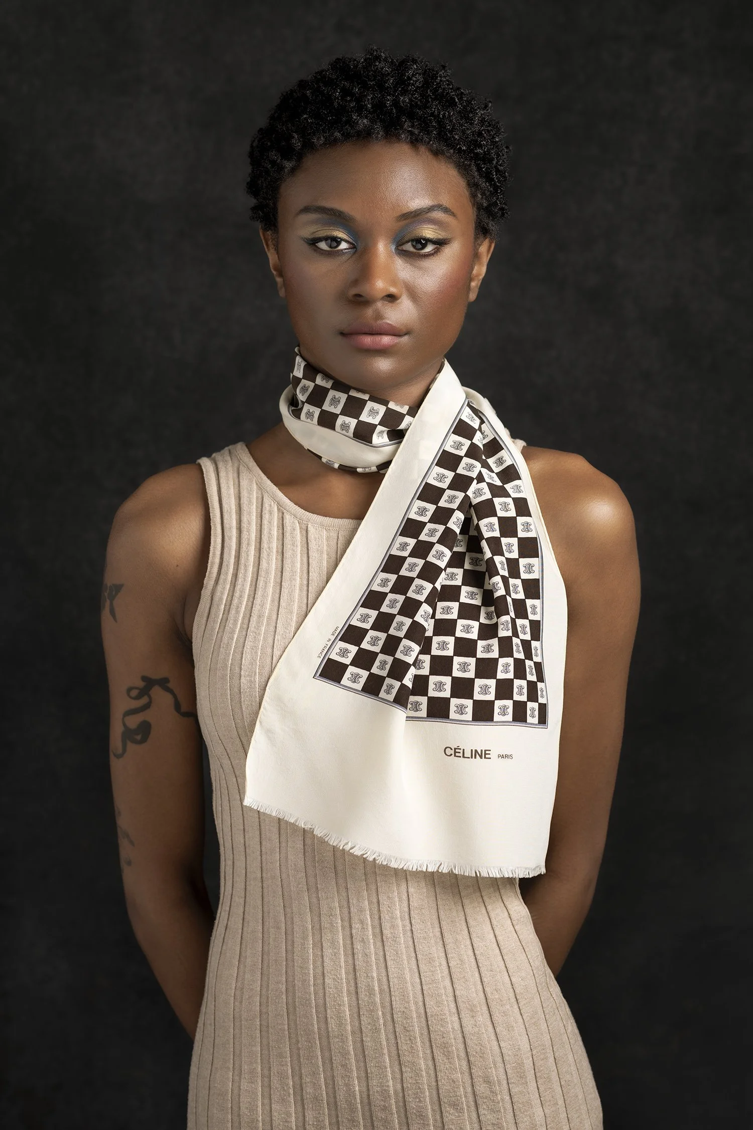 Fashion photography and Woman photographed in studio in New York Los Angeles and Seattle wearing silk Celine scarf made in France against hand painted back drop using Profoto lighting