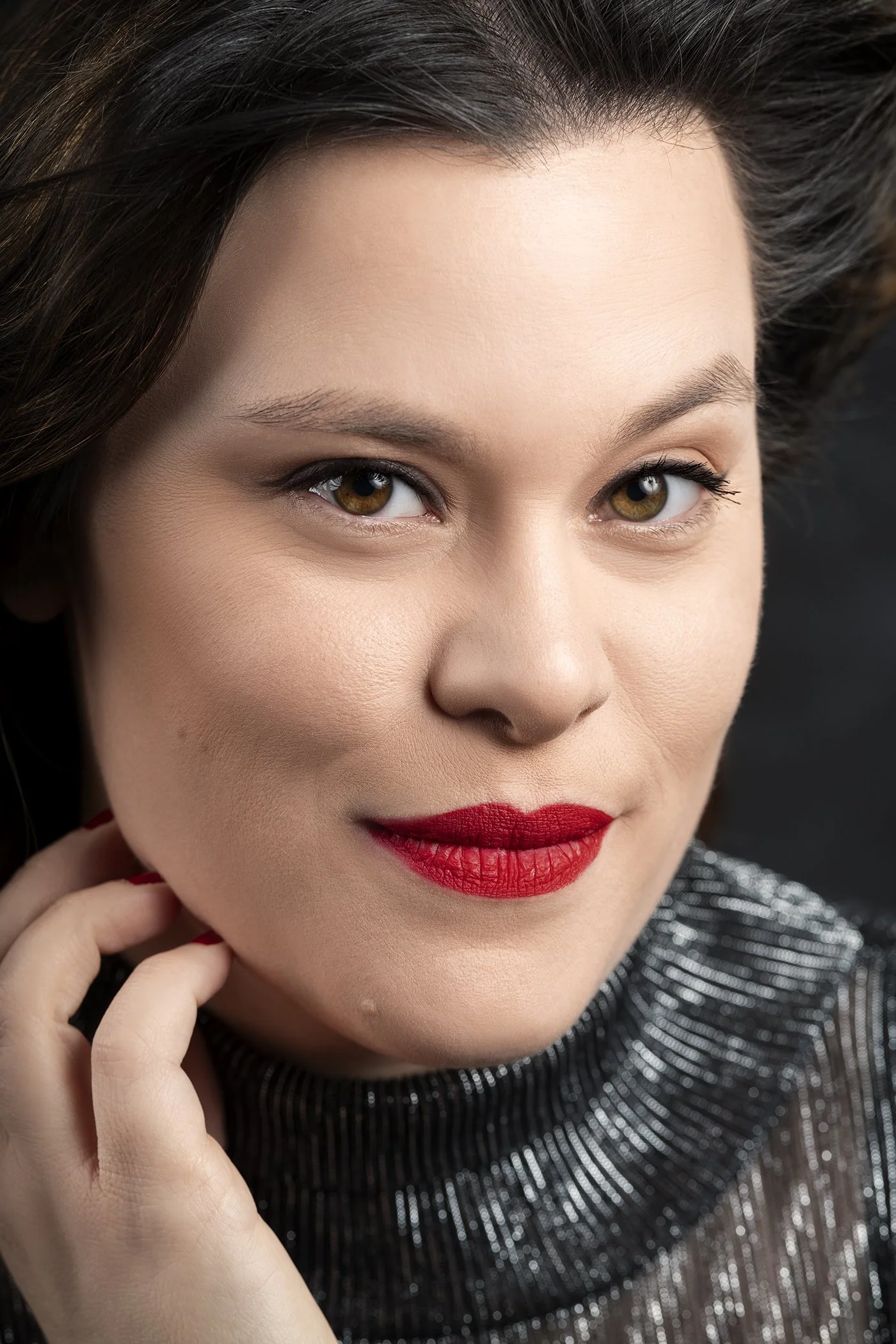 Close up headshot of woman with bright red lipstick photographed in Seattle