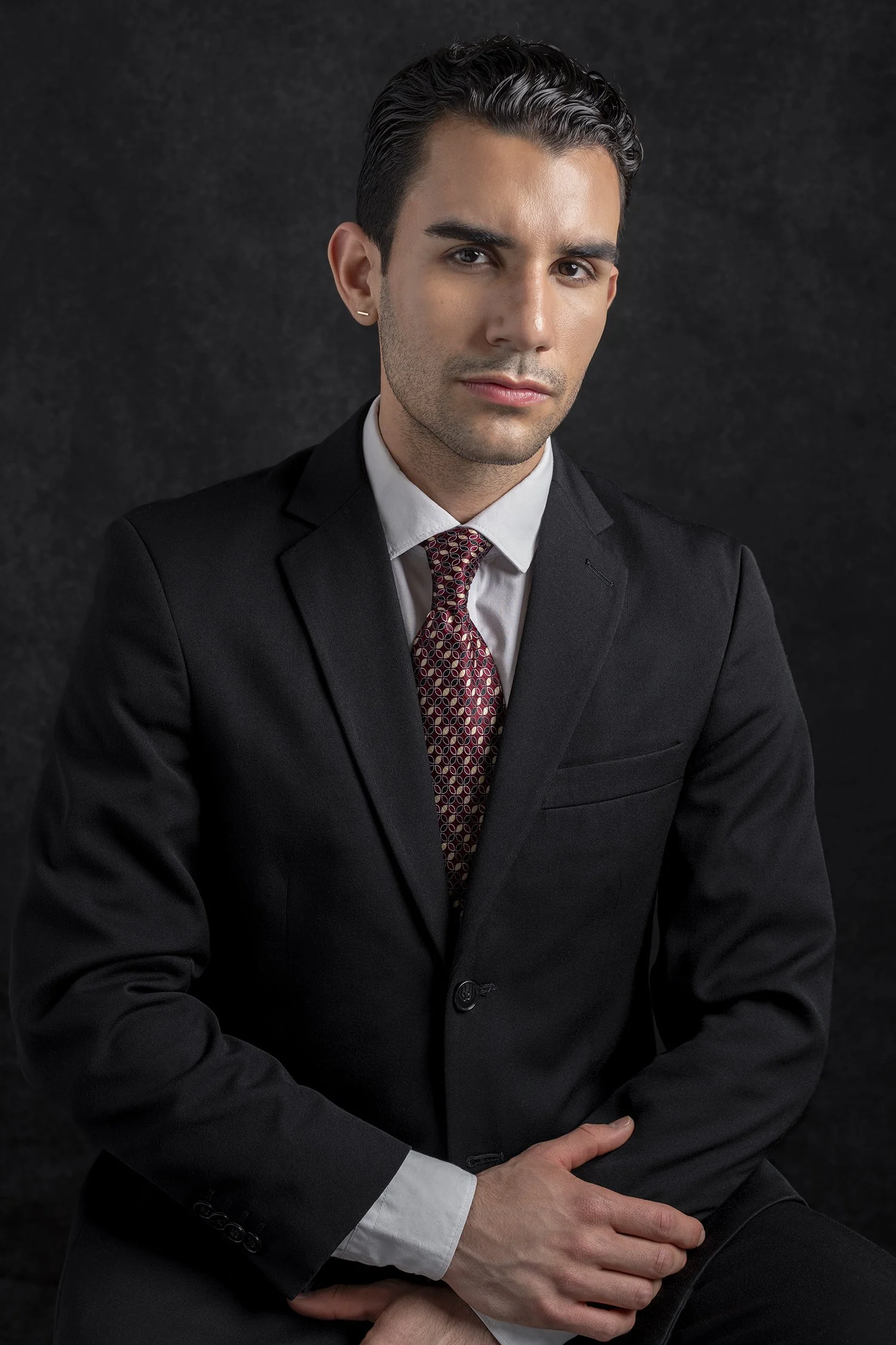 Business man and lawyer in legal profession with arms crossed photographed in headshot portrait style in Seattle New York and Los Angeles corporate photography
