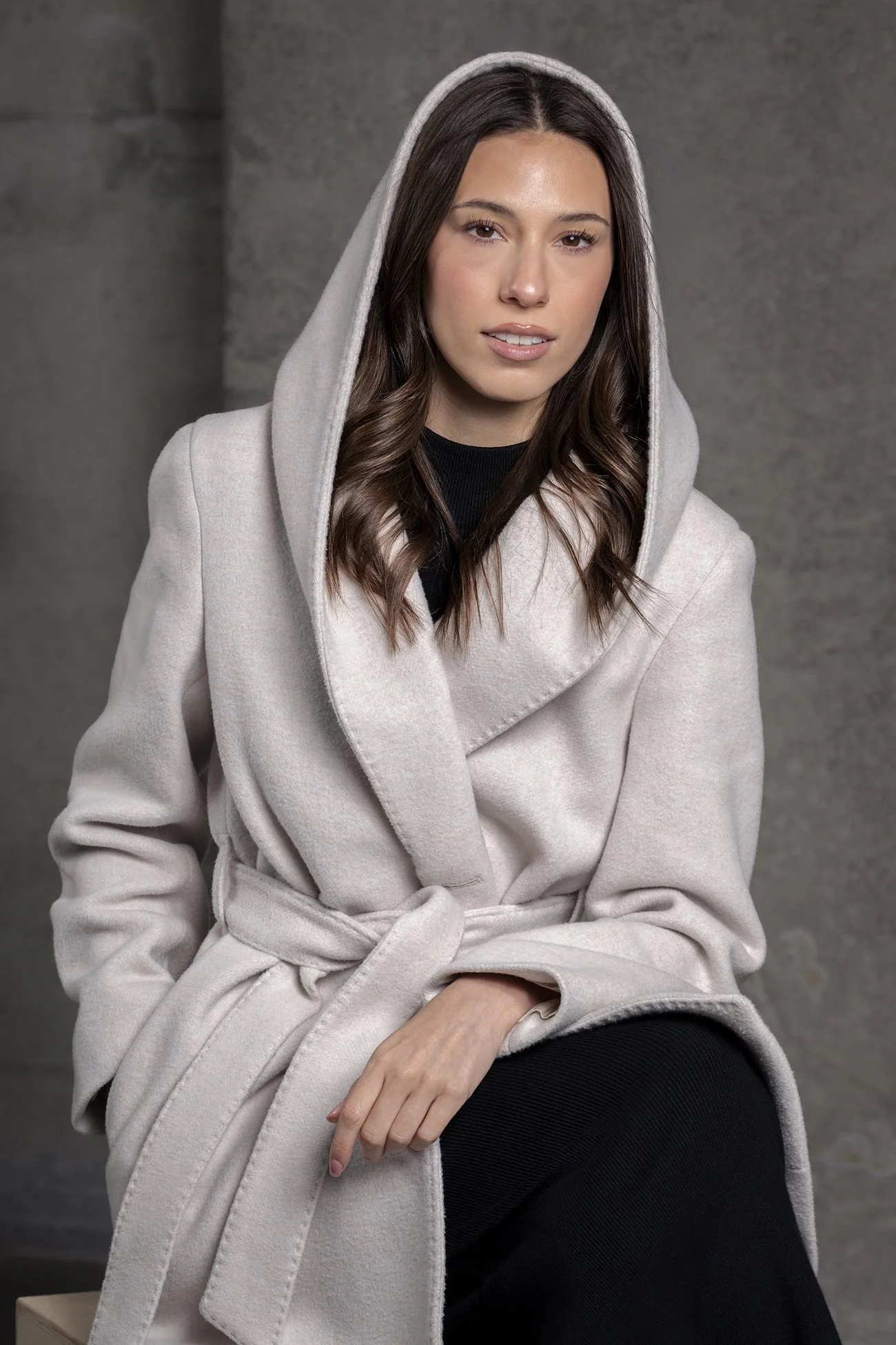 Woman in white creamy aritzia coat with hood photographed in Seattle lighting by Profoto