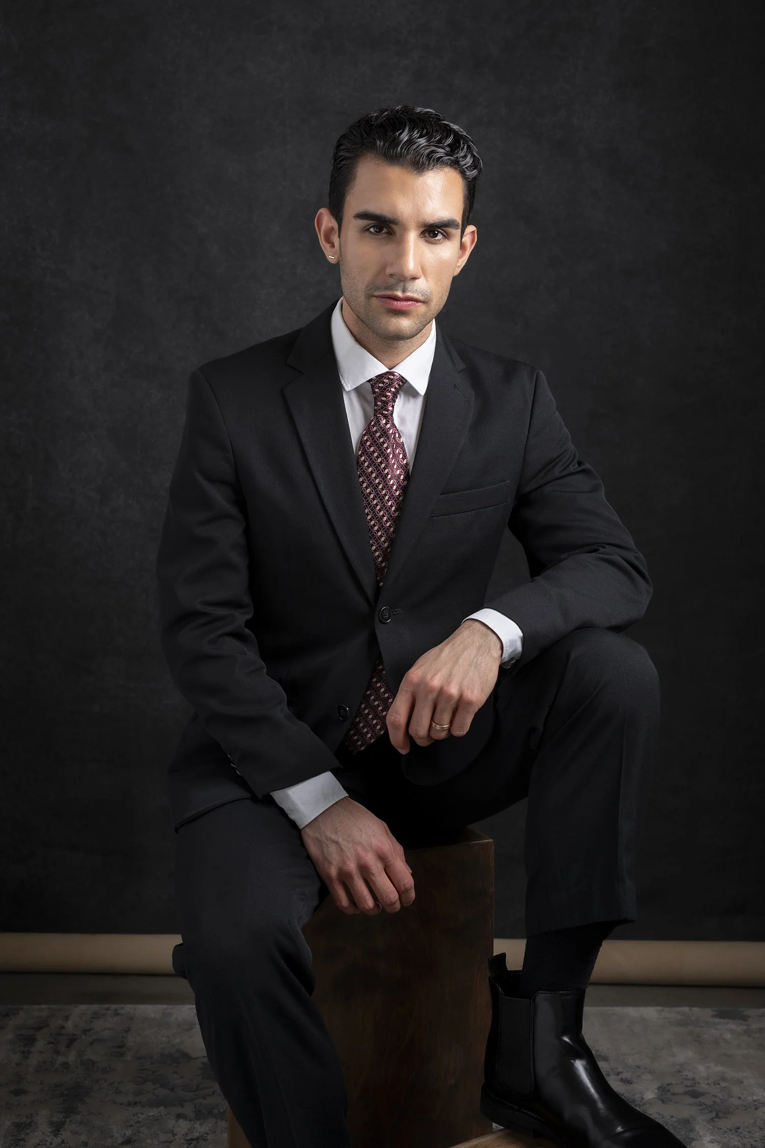 Business man and lawyer in legal profession with arms crossed photographed in headshot portrait style in Seattle New York and Los Angeles corporate photography