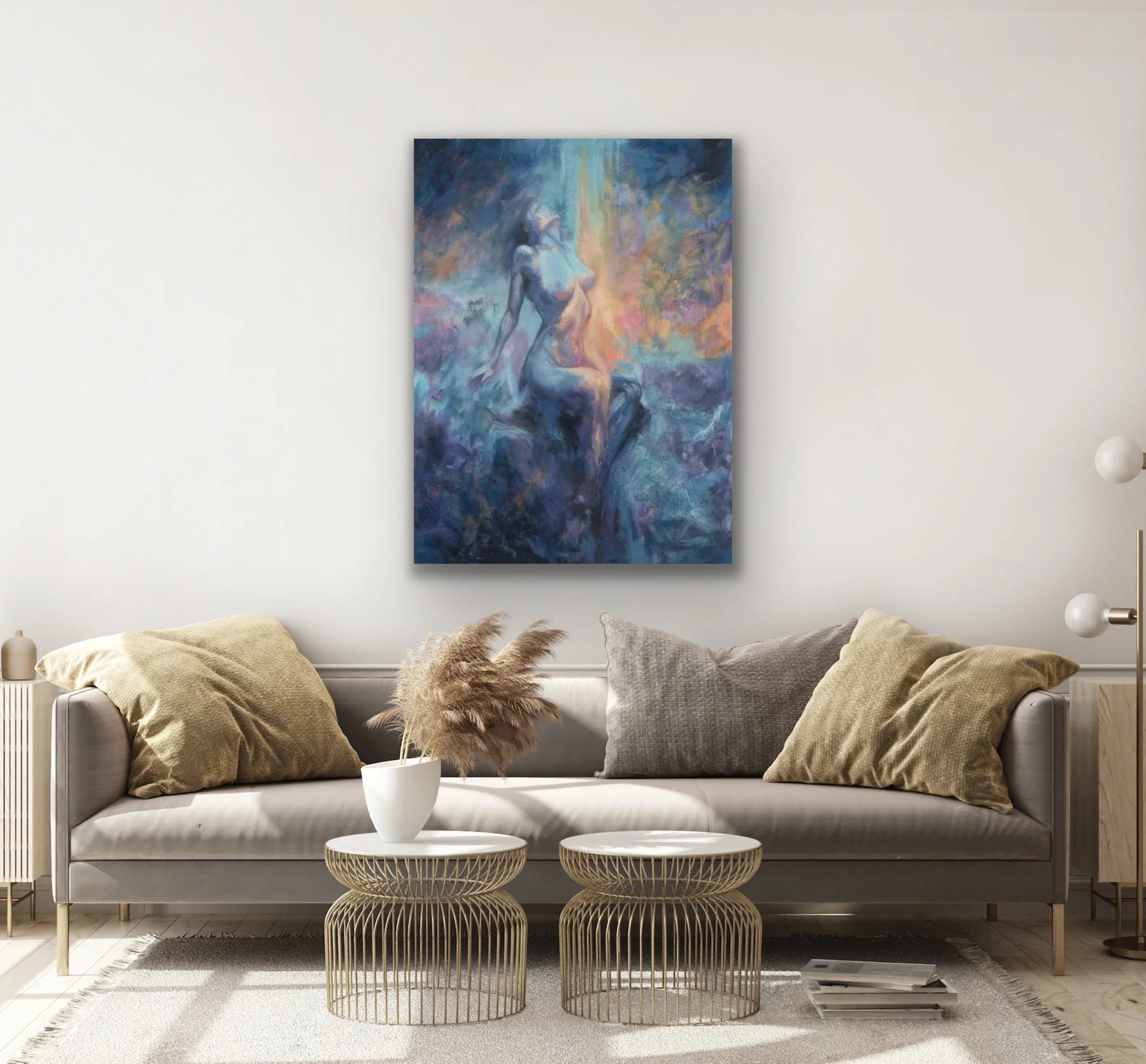 Moon's Breath mixed media oil painting hanging above a tan sofa with gold accent pillows in a living room