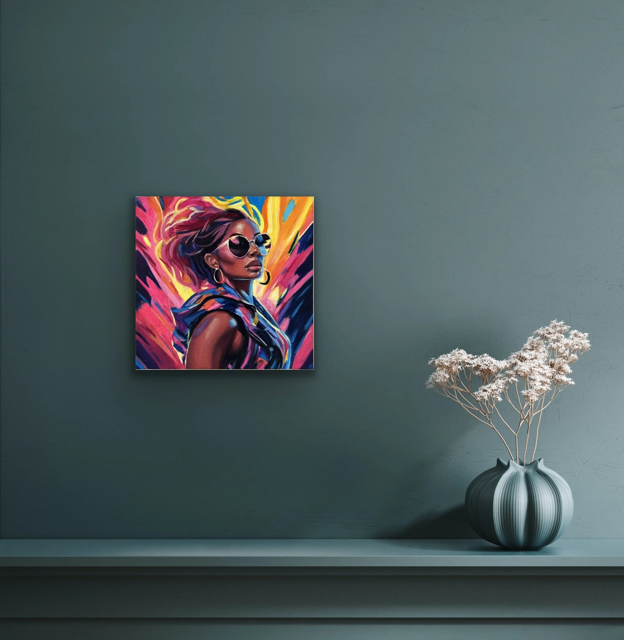 A vibrant portrait of a woman in sunglasses and hoop earrings displayed above a teal shelf with a vase of dried flowers.