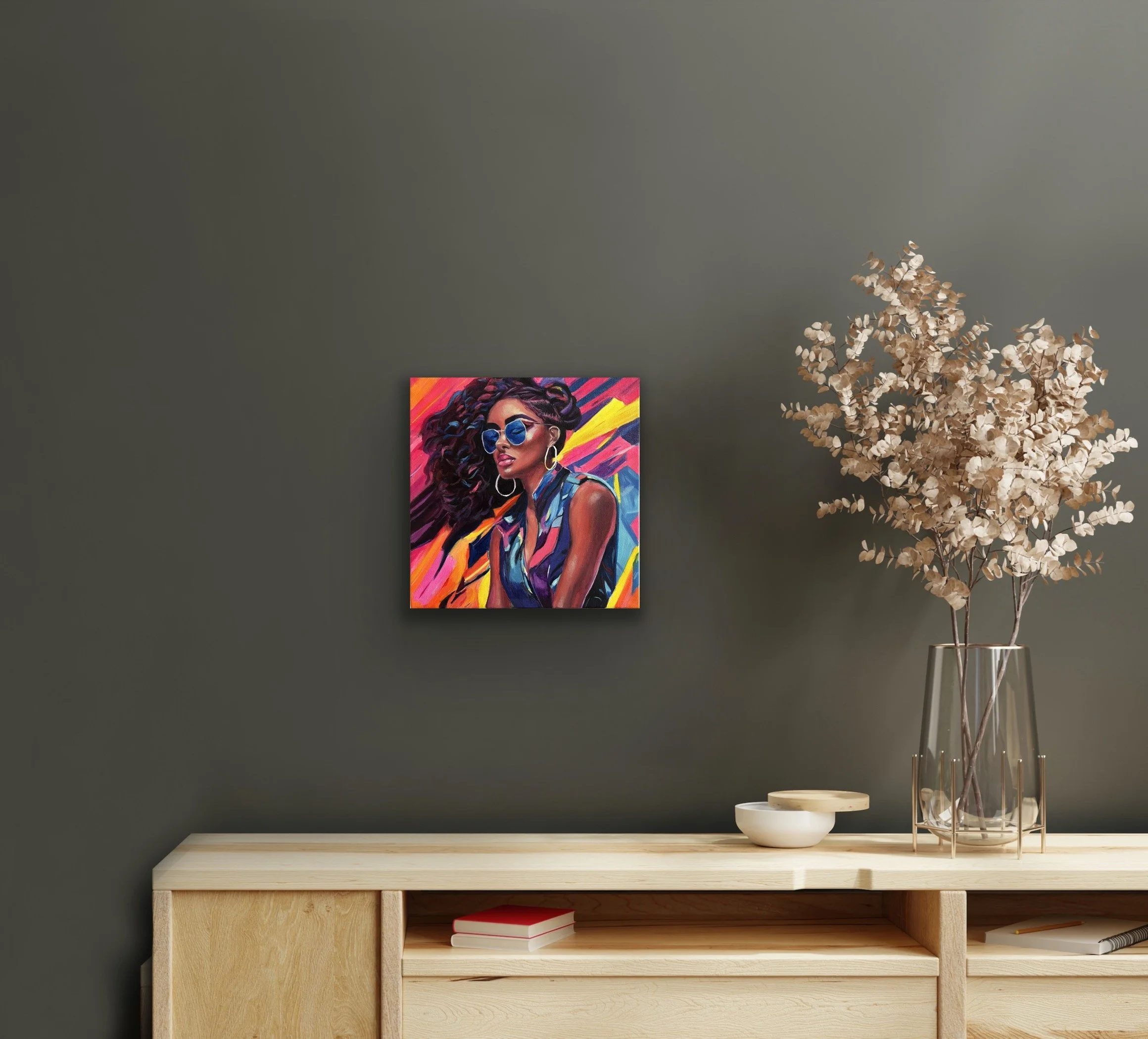 A vibrant portrait of a confident woman with curly hair, hoop earrings, and reflective blue sunglasses, displayed in a modern interior above a wooden console.