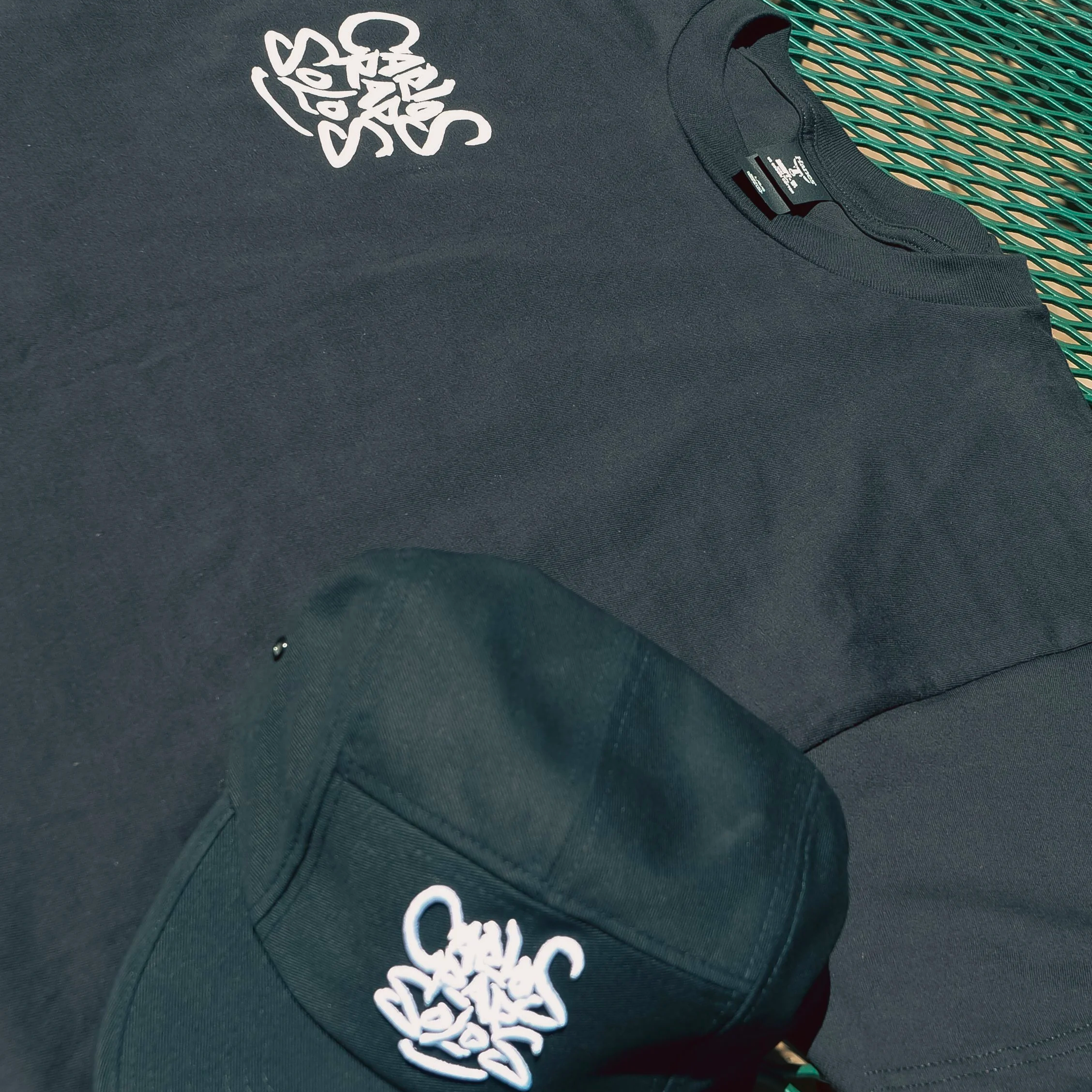 In+Frame-CR+T+Shirt+and+Hat+2.png