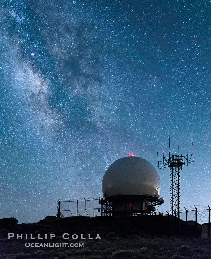 Image shows an FAA radar site underneath the Milky Way in the night sky