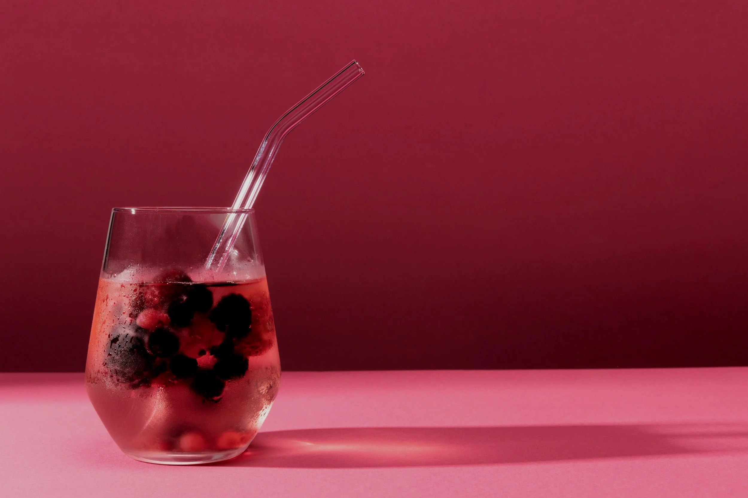 transparent-beverage-glass-with-glass-straw.jpg