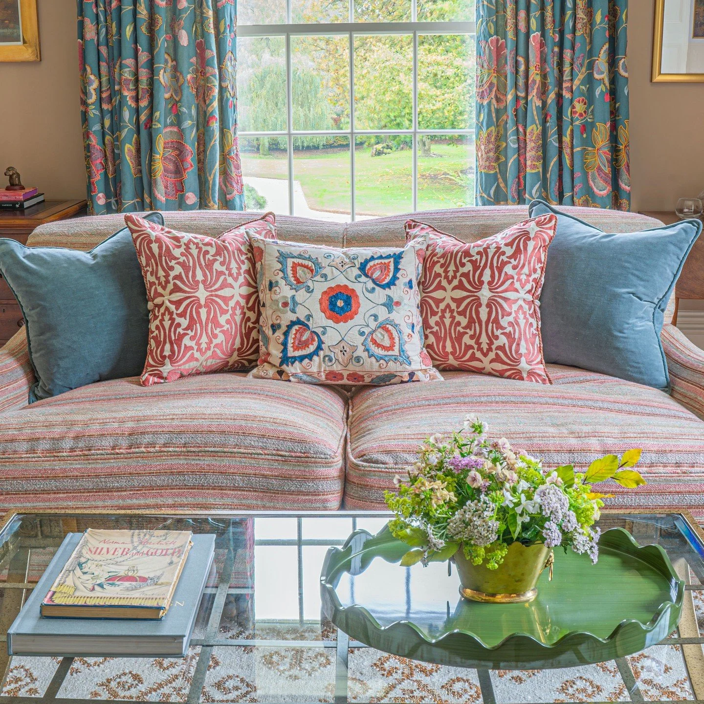 If rooms could speak, I wonder what this one would say. I hope it would invite me to sink into its plump sofa, lean back into the luxurious cushions and settle in beside a glowing log fire. The embroidered curtains would draw closed behind me, creati