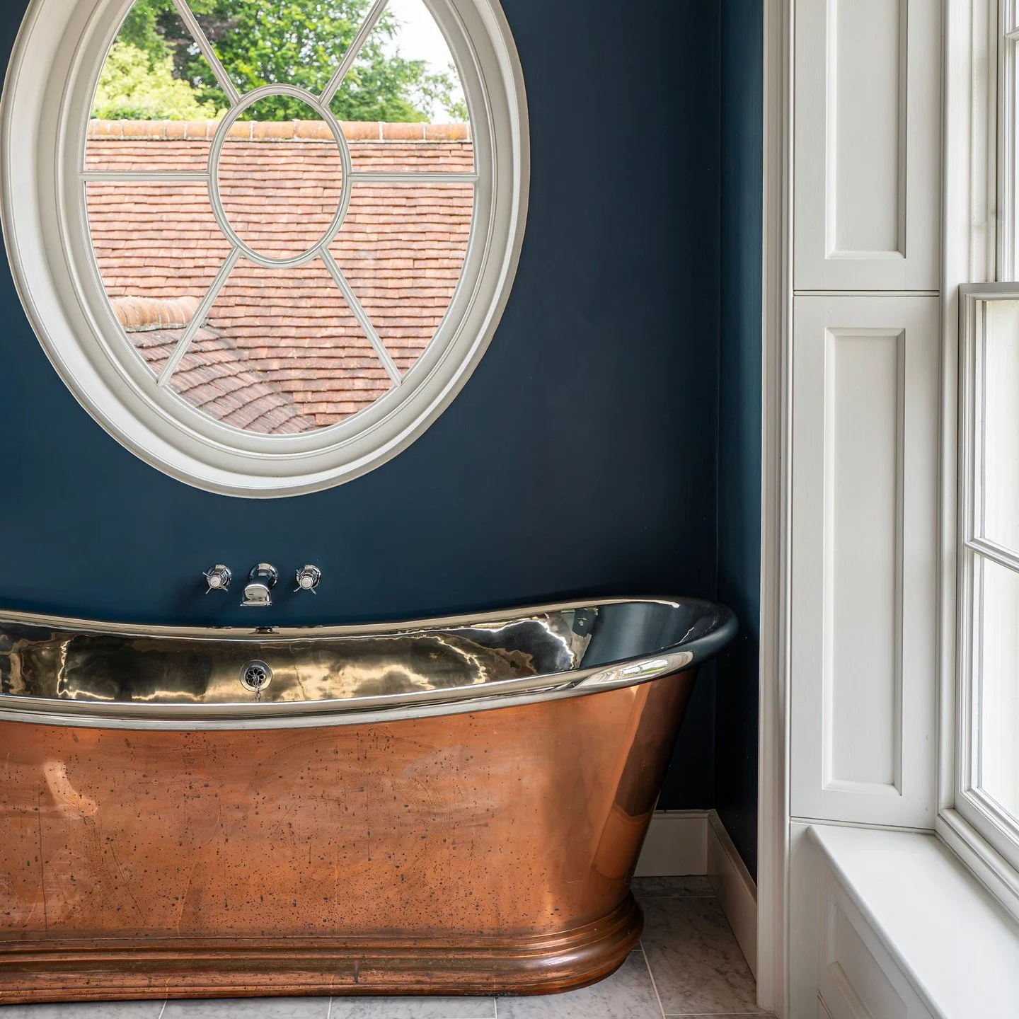 This was one of my favourite projects to work on, largely because of the architecture and the opportunity it gave us to really shape the space.

To complement the copper bath, we leaned into depth of colour and richer marble tones. The darker backdro