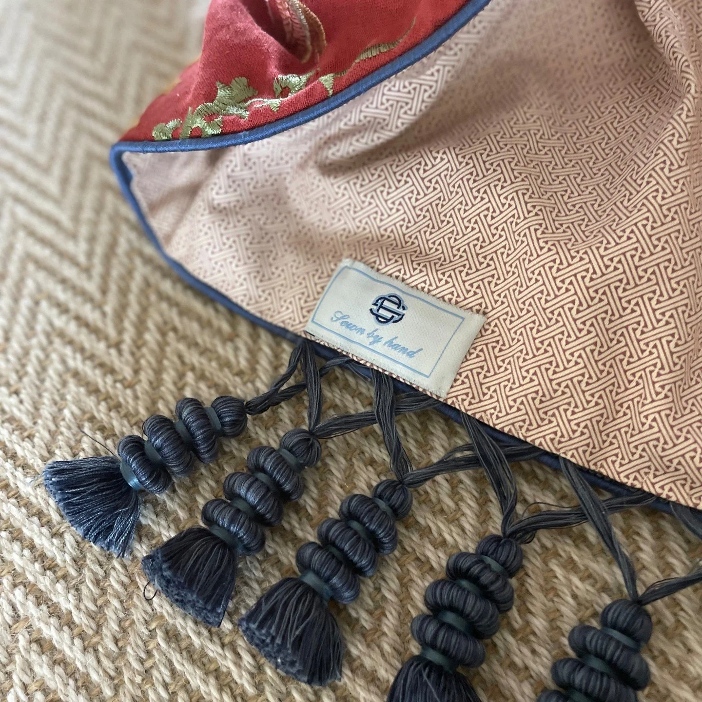 It is often the smallest details that carry the most weight.

A contrast lining. A tailored piping edge. A beautifully considered trim.

These layers are what elevate a scheme from simply decorated to deeply considered. Texture against texture, patte