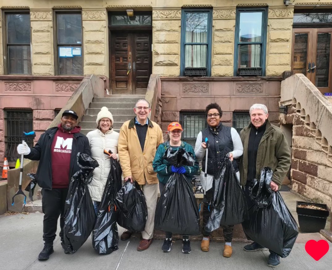 Board members working with a local block association to pick up trash around the neighborhood.