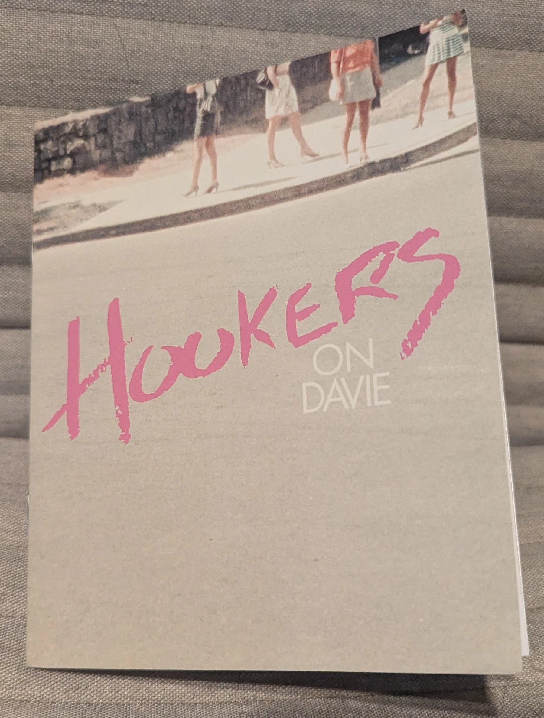 Book titled 'Hookers on Davie' with a photo of four women walking on a sidewalk on the cover.