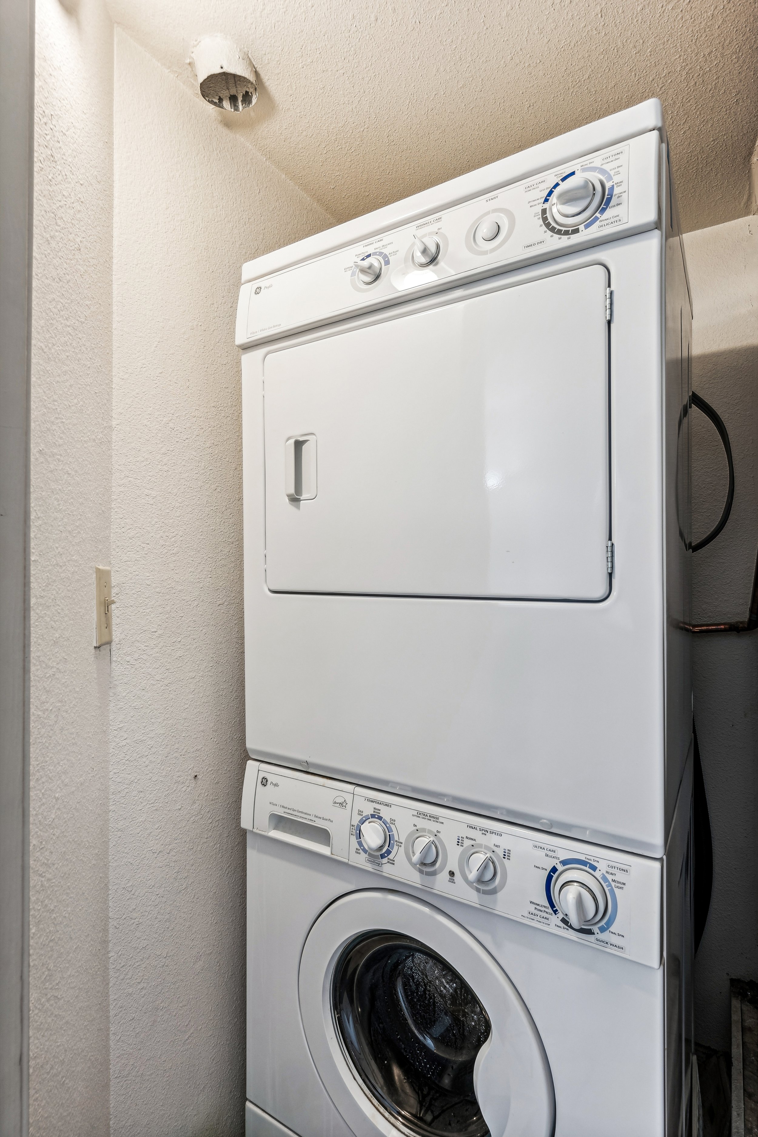 Unit 207 - A photograph of the washer and dryer unit.