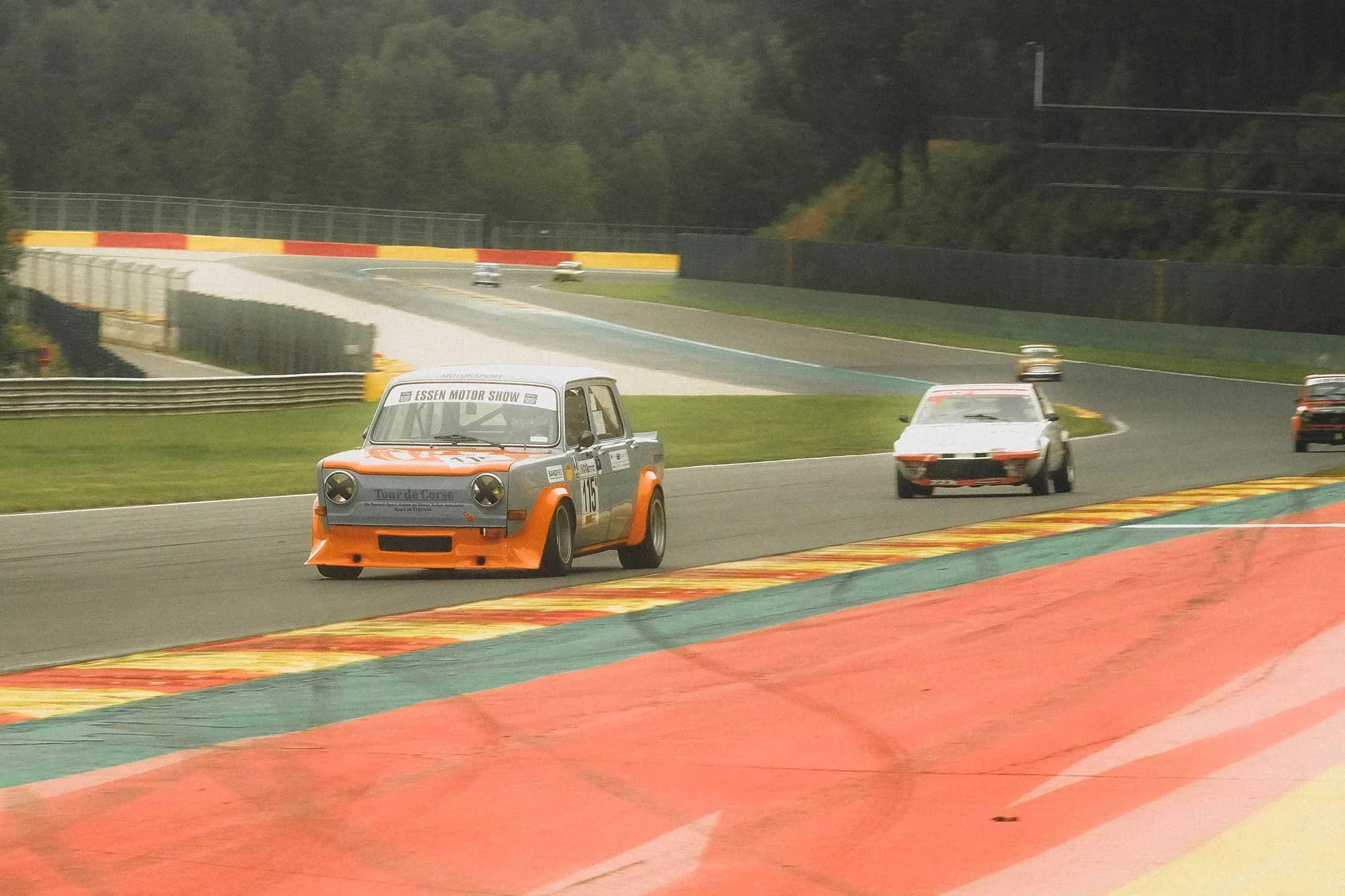 Front angle view photo of a vintage 1966 blue NSU Prinz 1000 TT car in a mountain road location. Bespoke build by premium car restoration and modification workshop Retro Sporting in California.