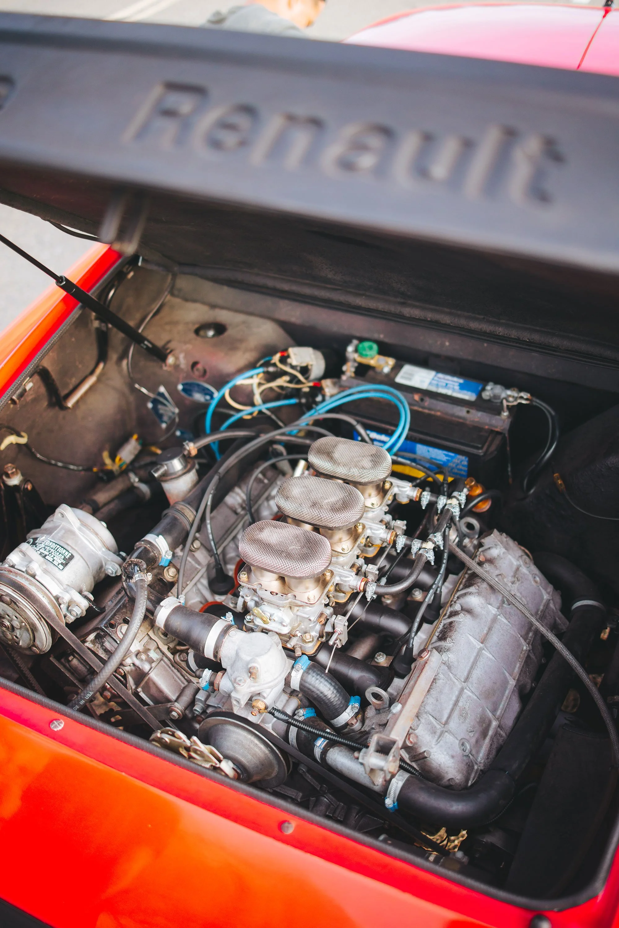 Engine detail view photo of a vintage 1980 red Alpine A310 car. Bespoke build by premium car restoration and modification workshop Retro Sporting in California.