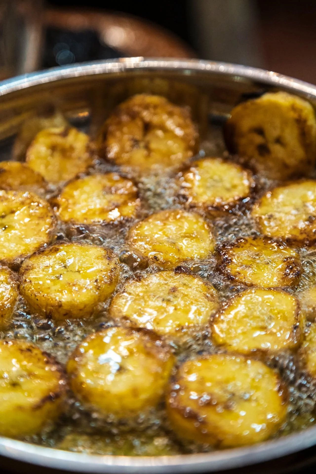 Plantains fry in oil to sweeten the mole.
