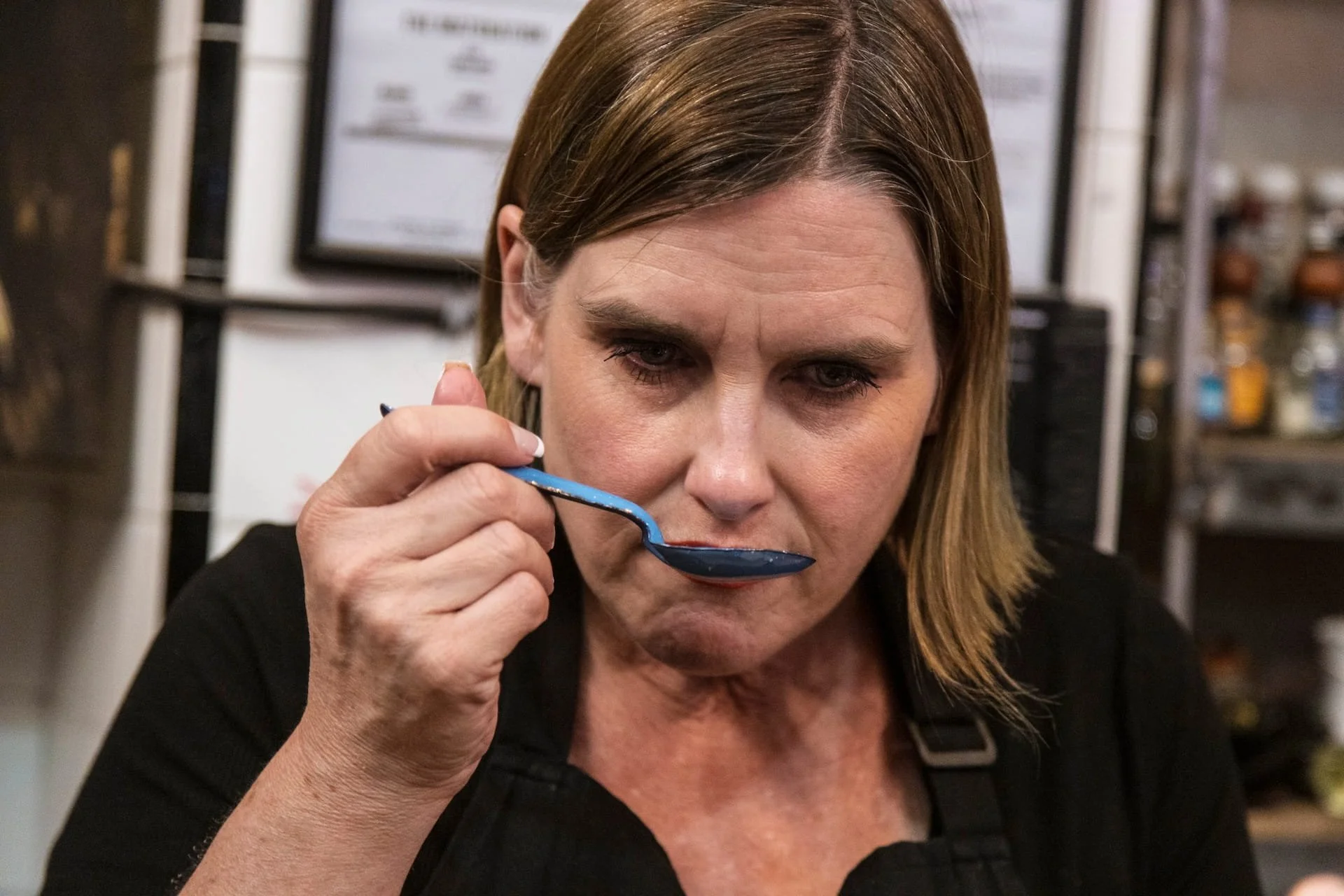 A guest tastes mole at a cooking class in Mexico City.