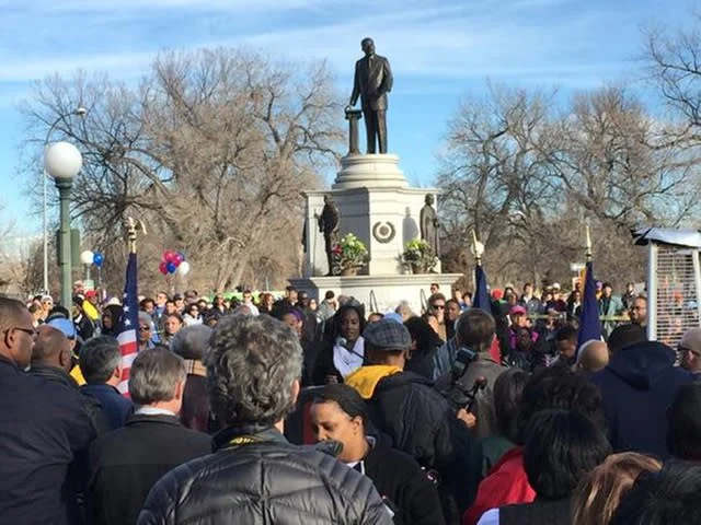 a crowd of marchers around the MLK memorial