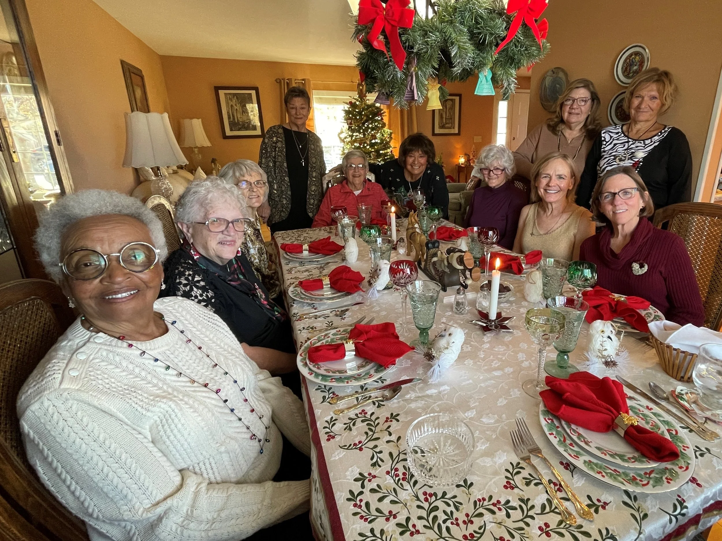 St Luke's Daughters of the King gather around a beautiful Christmas table before their feast