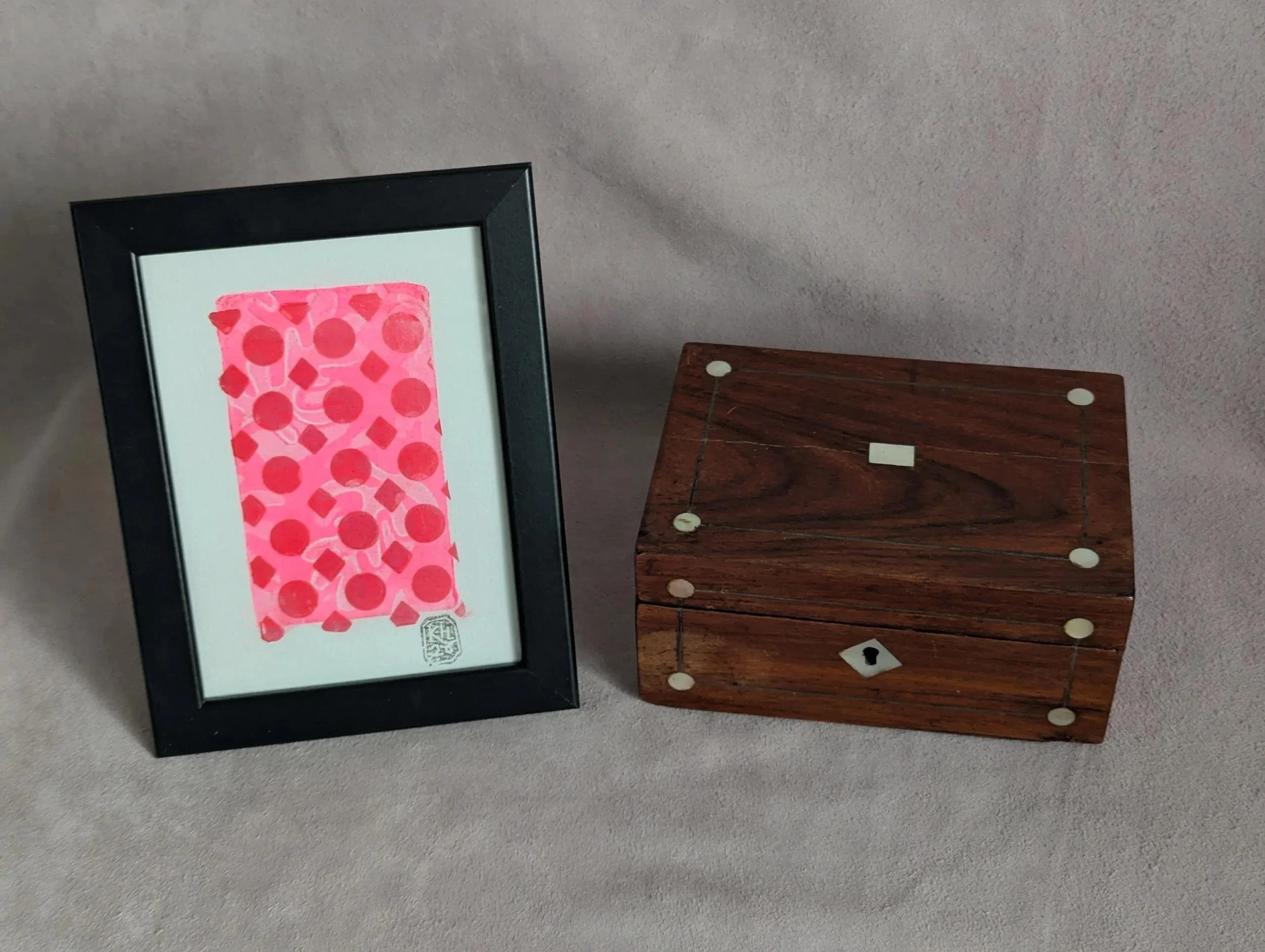 Red lattice over pink leaves iridescent monoprint