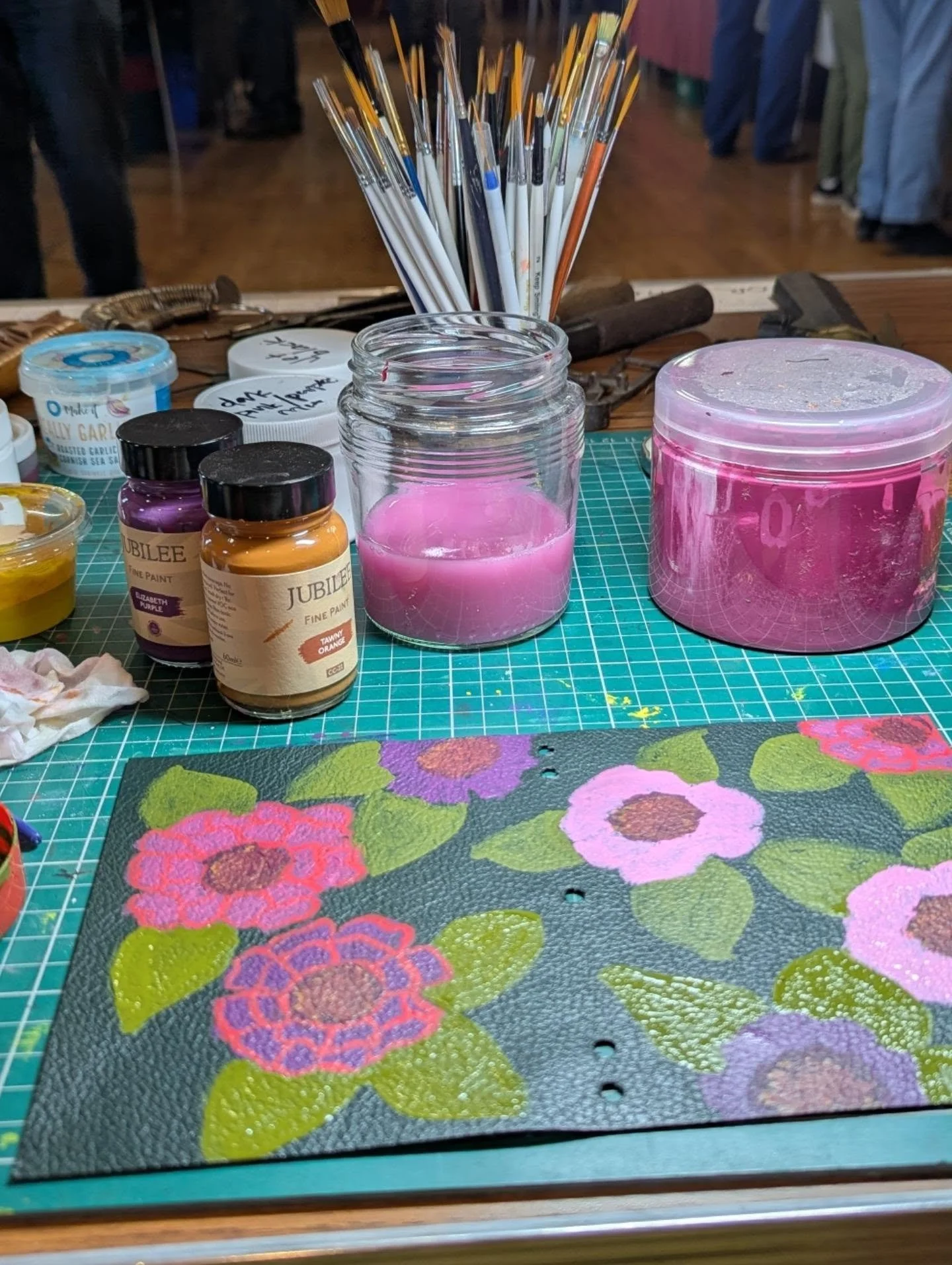 Zinnias! 

Using a fairly limited palette of chalk paints on a leather notebook cover. I'm enjoying the challenge of getting depth with layering with such opaque paints.