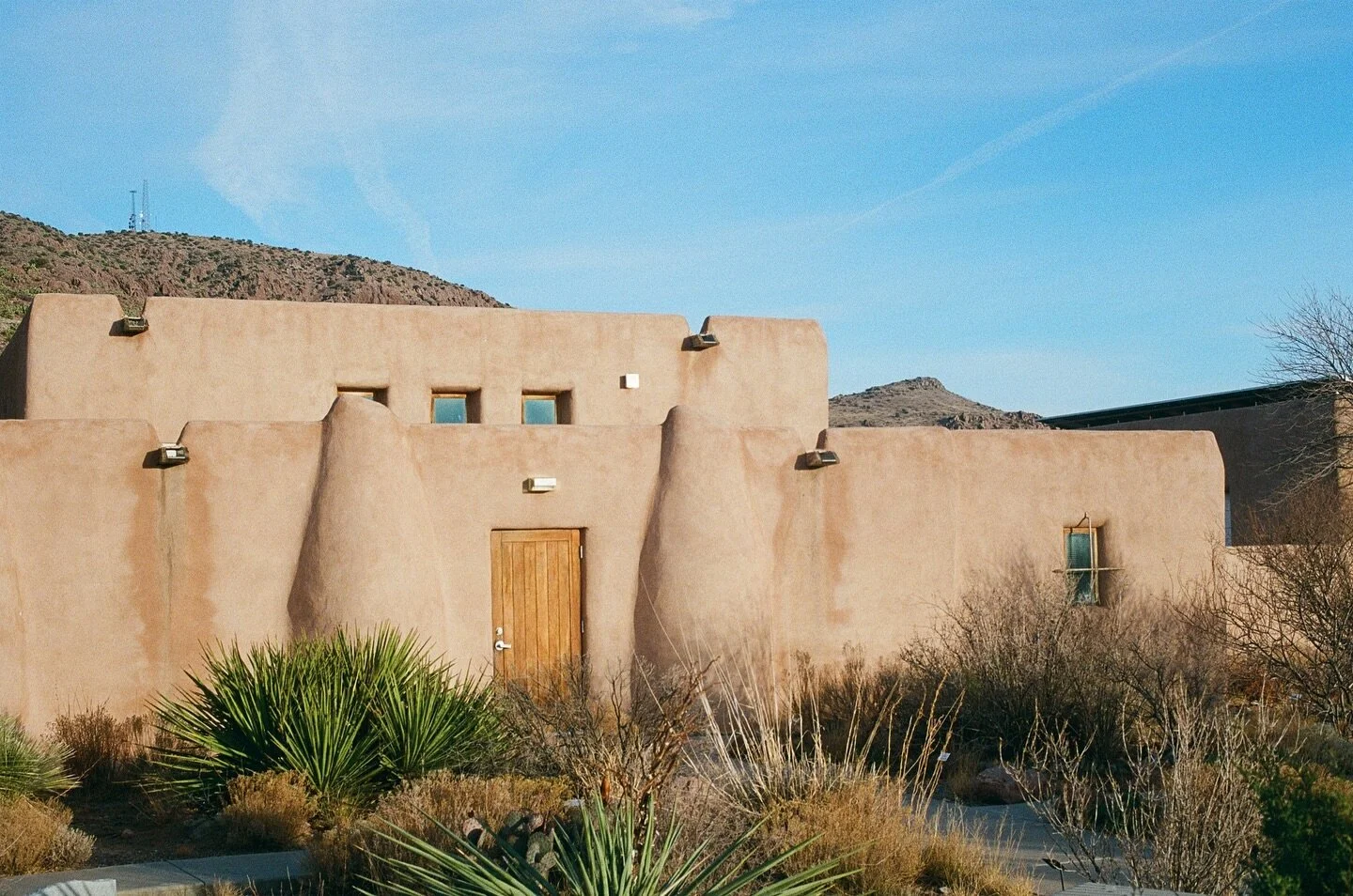 Pueblo architecture is regional to Southwestern United States, famously known in New Mexico but also occurs in some areas of Arizona. 

It is a traditional type of design modelled after Cliff Dwellings built by the ancestral Pueblo Peoples. 

The tra